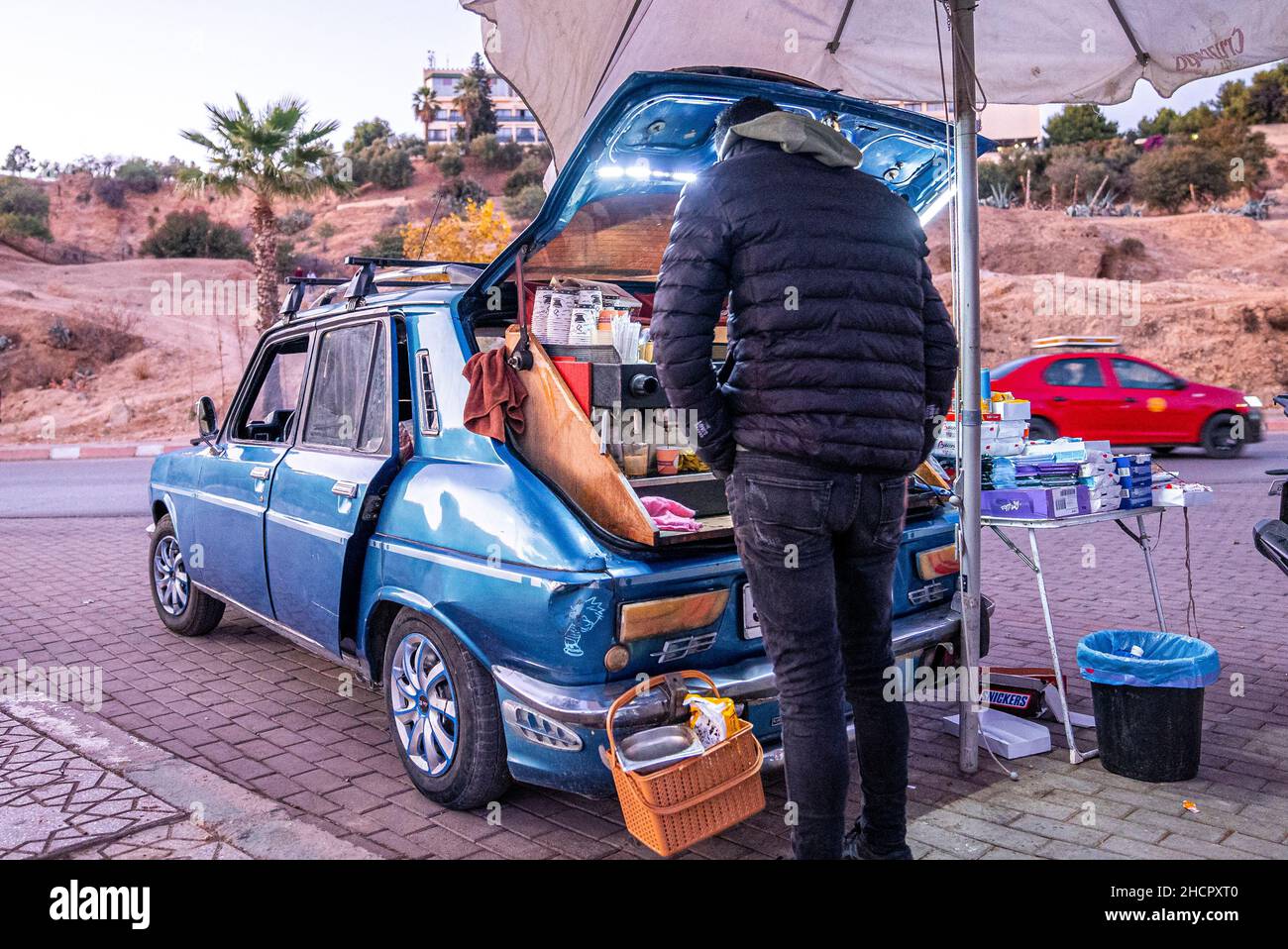 Vendor selling freshly ground coffee made from the trunk of a car Stock Photo