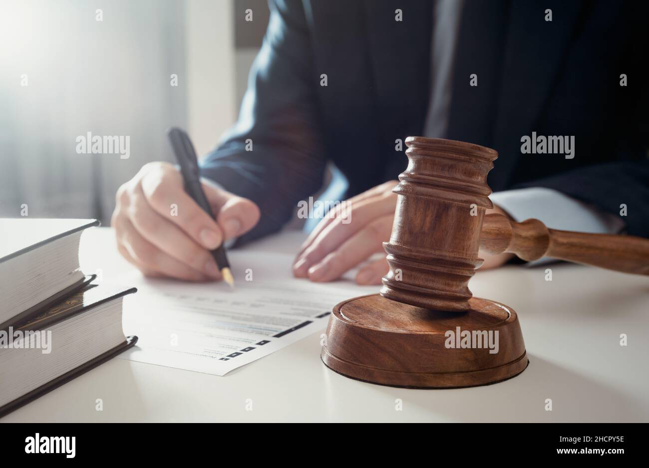 Attorney, clerk, bookkeeper working in the office. Signing contract or agreement concept Stock Photo