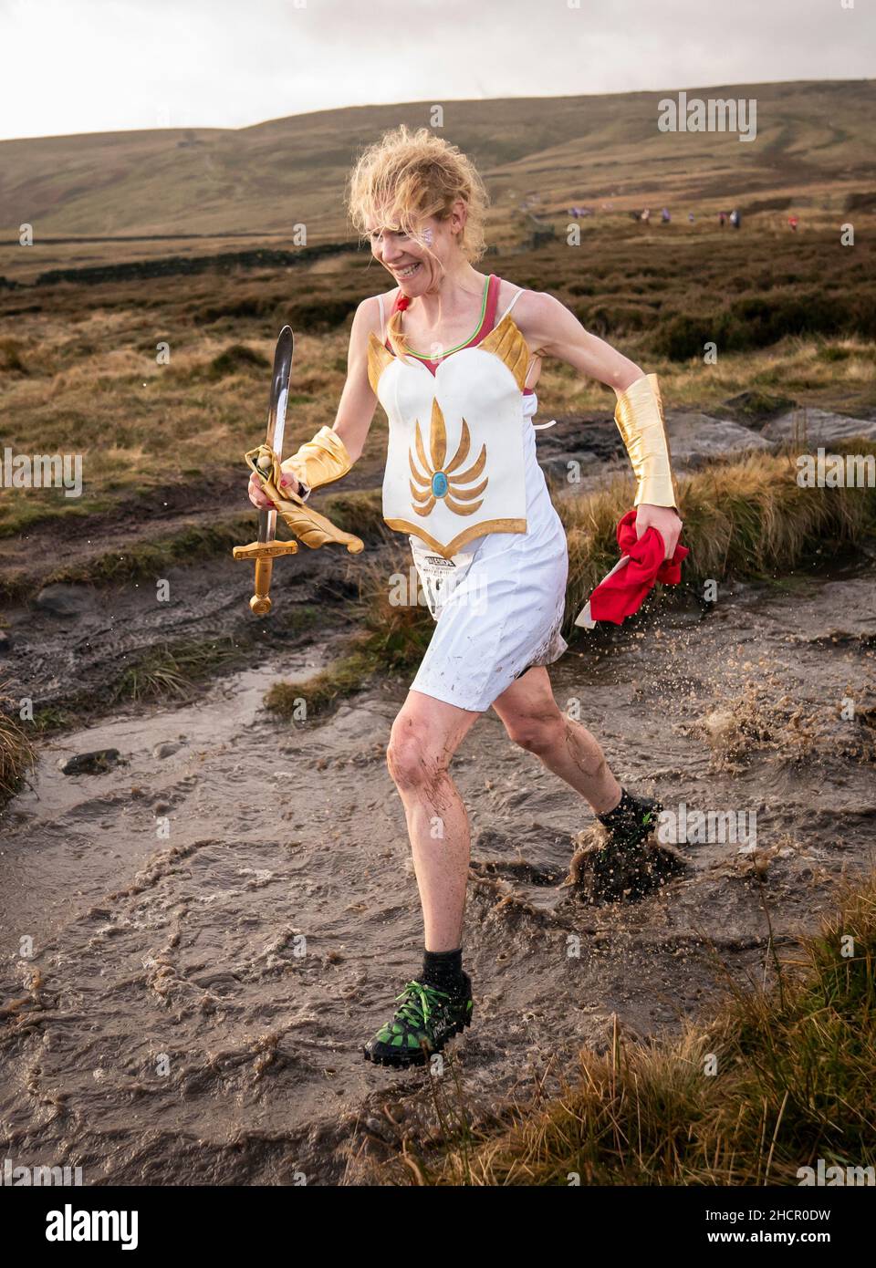 A competitor in fancy dress run across the Pennine tops near Haworth, West Yorkshire, in the annual Auld Lang Syne Fell race which attracts hundreds of runners every year. Picture date: Friday December 31, 2021. Photo credit should read: Danny Lawson/PA Wire Stock Photo