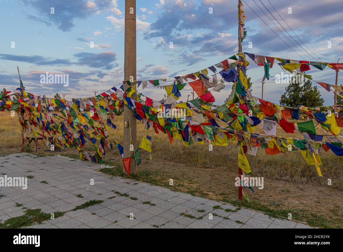 Buddhist flags near Geden Sheddup Choikorling Monastery, Tibetan Buddhist monastery in Elista, Republic of Kalmykia, Russia Stock Photo