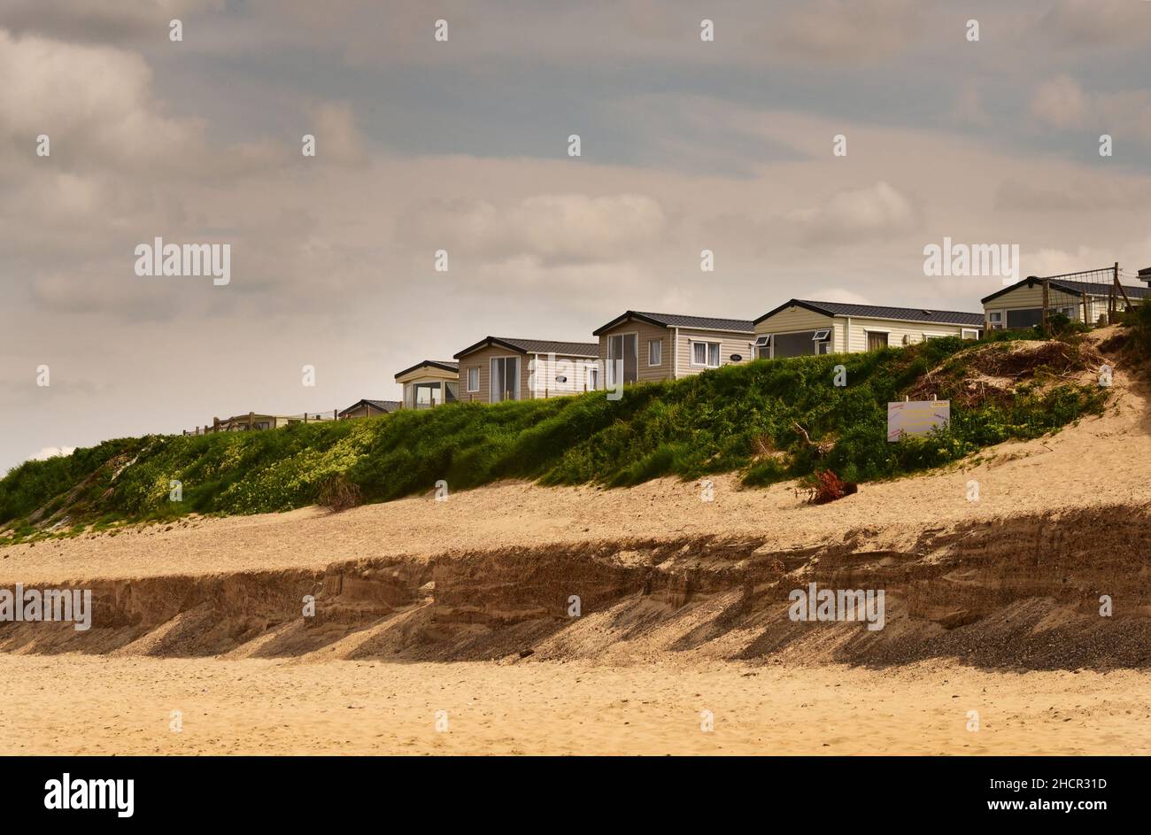 Houses and Coastal Erosion with Sandscaping at the Beach and Cliffs at ...