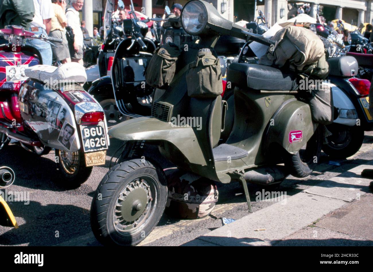 Military scooter in army green colour with water bottles on the front Stock Photo