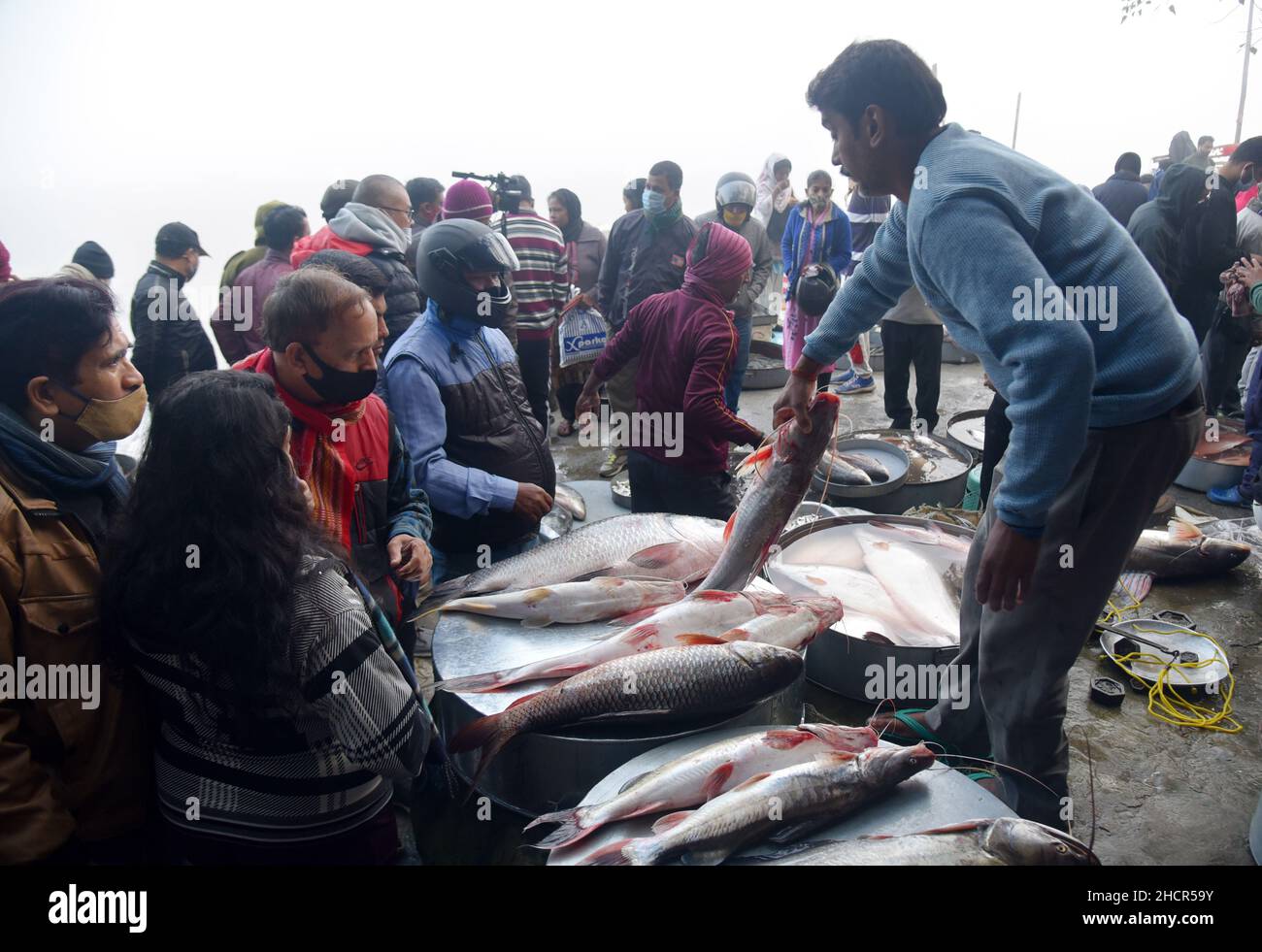 Guwahati, Guwahati, India. 31st Dec, 2021. People buys local fishes on