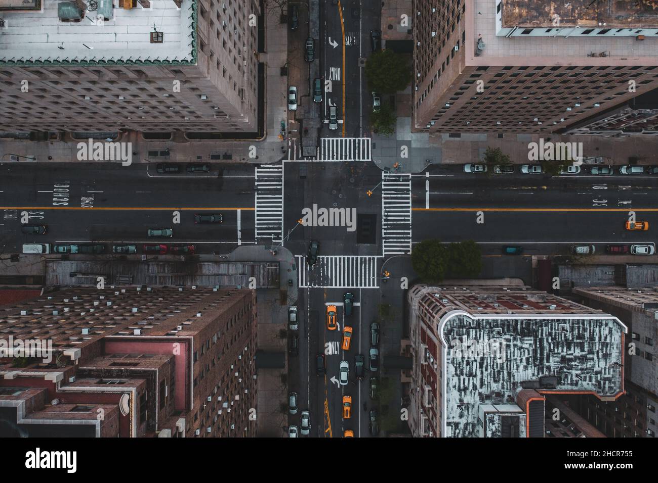 Bird's eye view of the traffic at the crossroad surrounded by skyscrapers Stock Photo Alamy