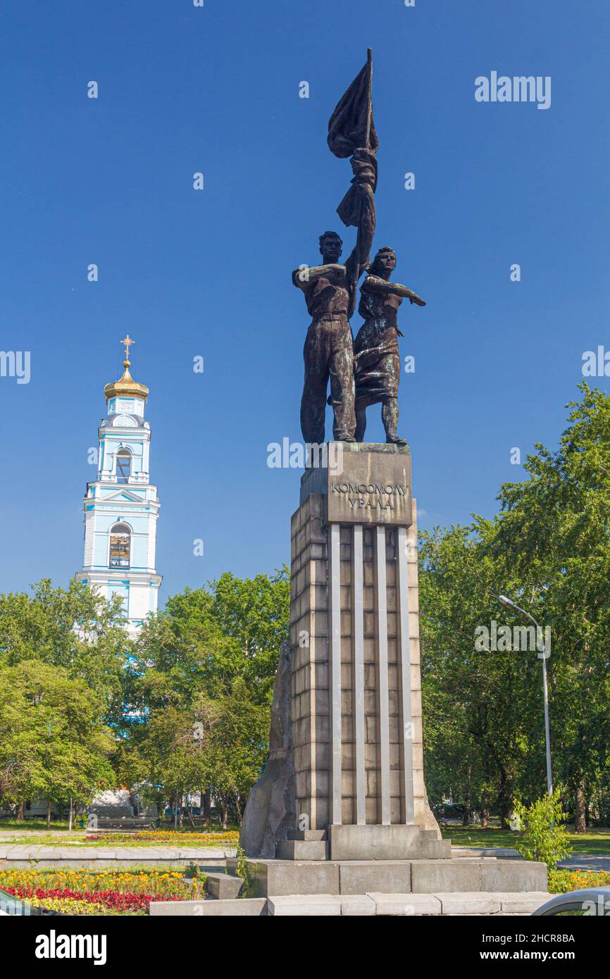 YEKATERINBURG, RUSSIA - JULY 3, 2018: Monument to the Komsomol of Ural and the Bell tower of the Ascension church in Yekaterinburg, Russia Stock Photo