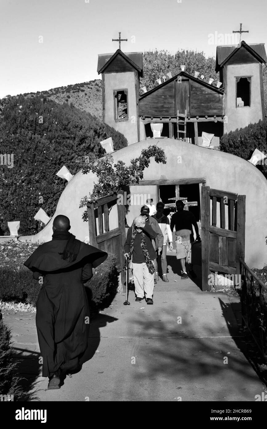 Tourists visit the historic 19th century Santuario de Chimayo church in Chimayo, New Mexico. Stock Photo