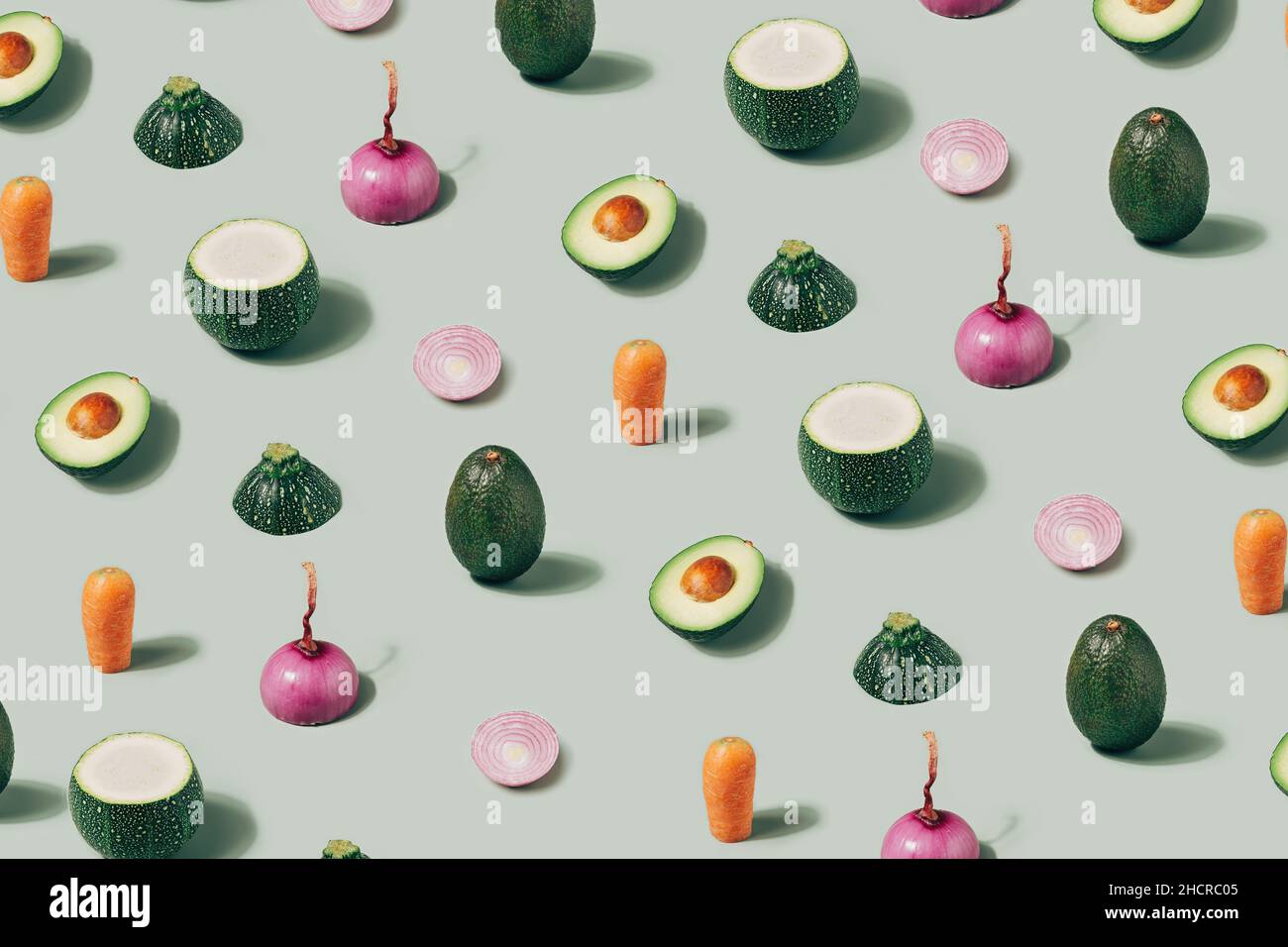 Various vegetables arranged on a light green background. Vegan diet minimal pattern Stock Photo