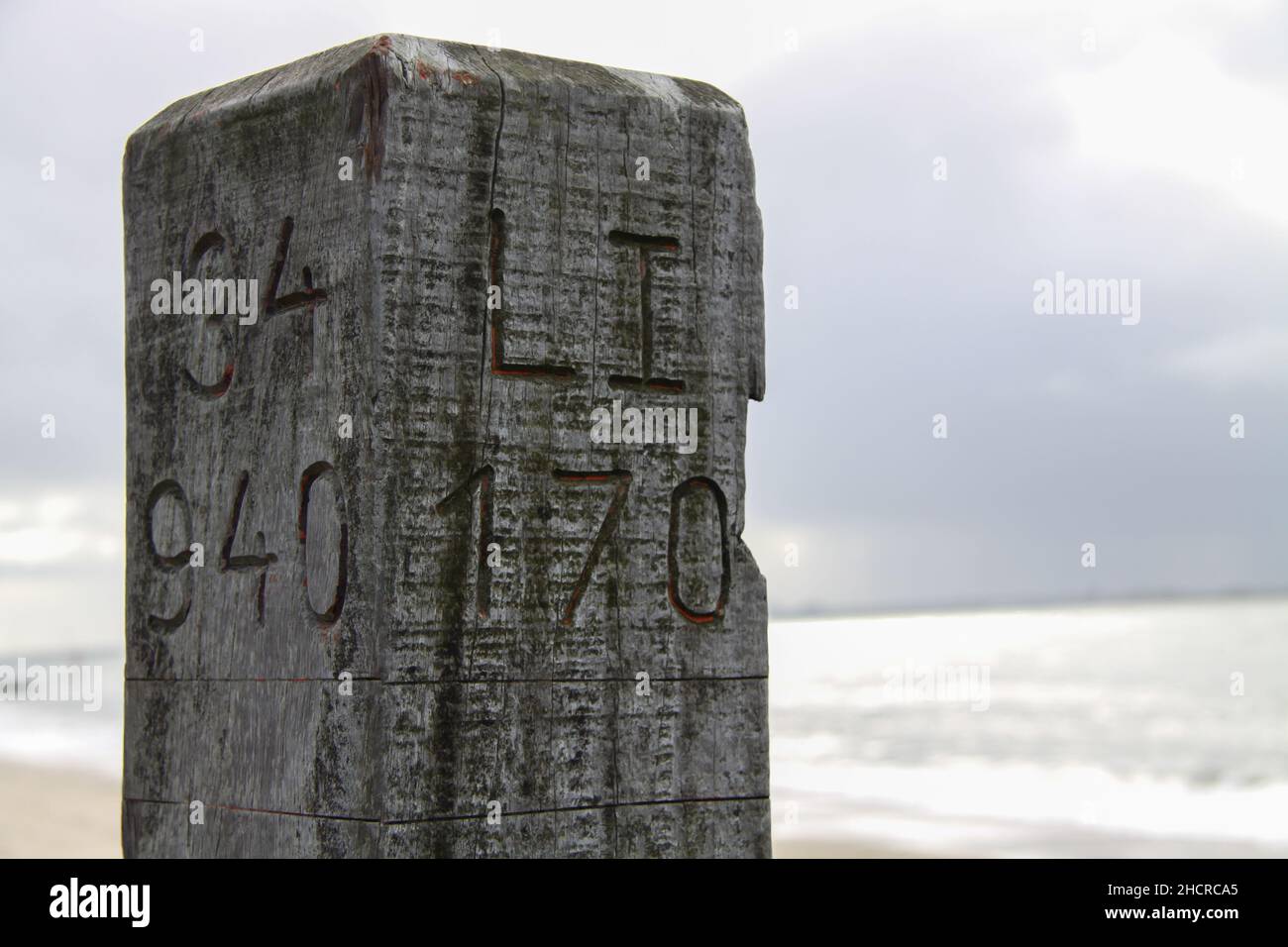 Beautifu shot of a wooden pole in a beach Stock Photo