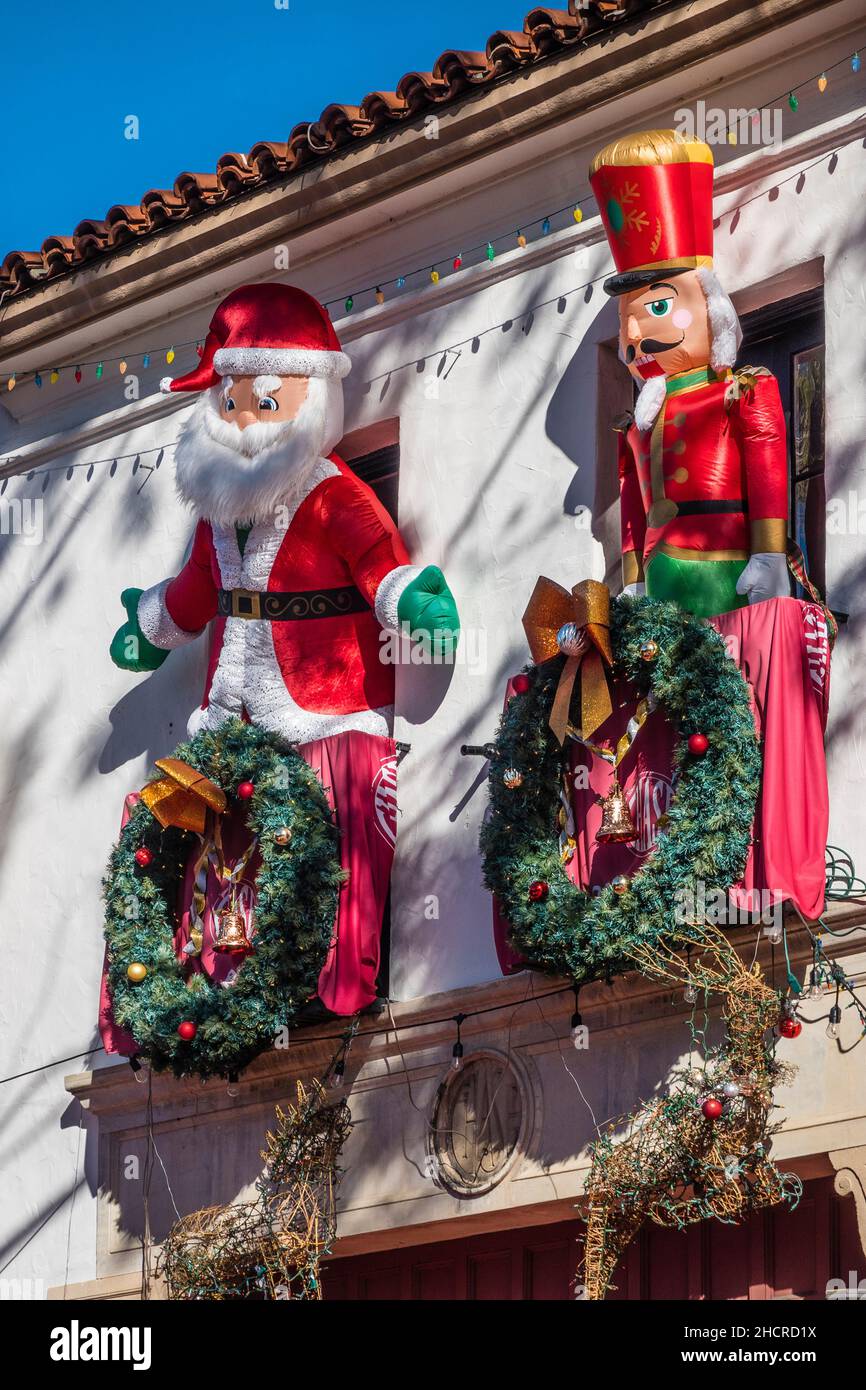 A blow-up santa and a nutcracker Stock Photo