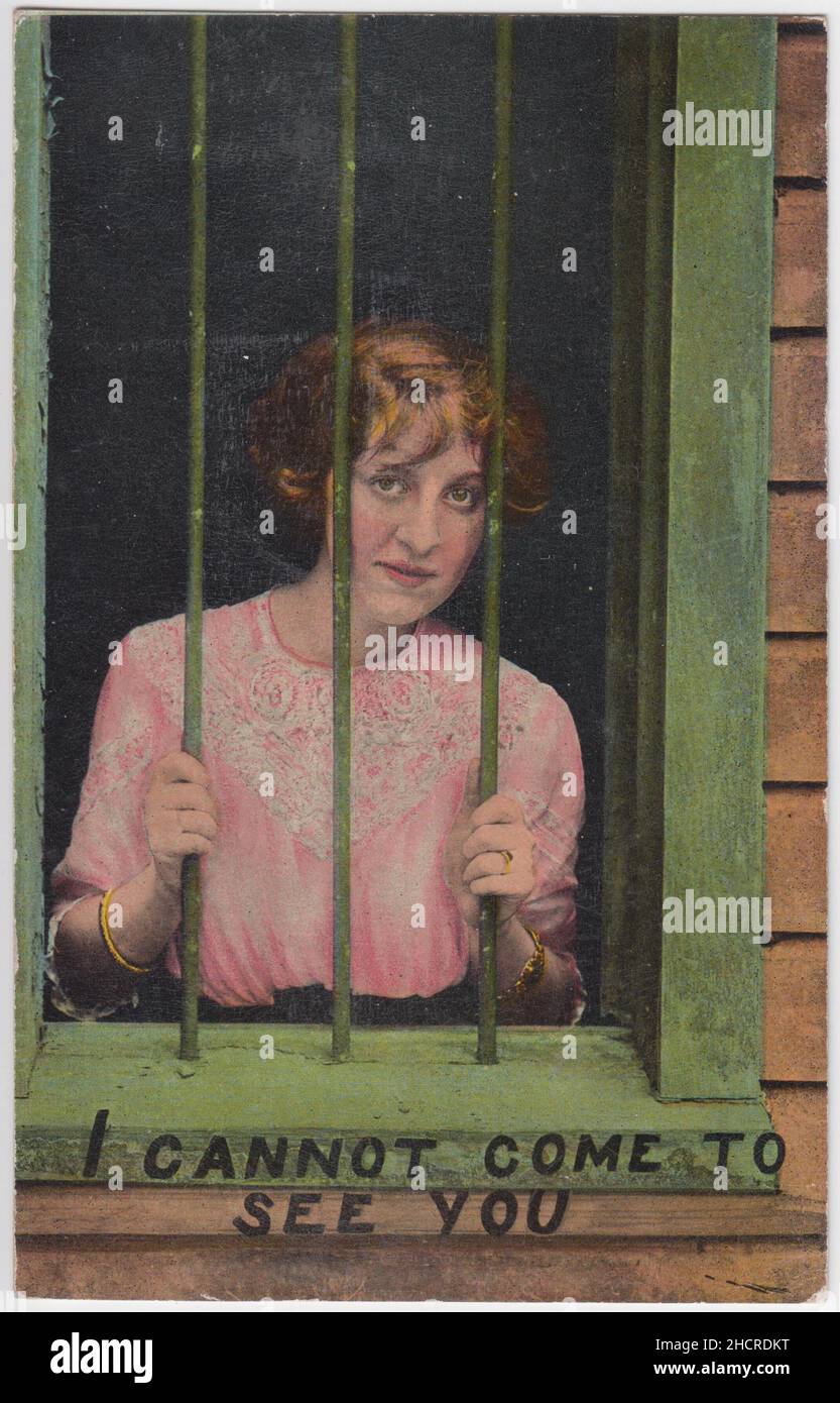 'I cannot come to see you': postcard of a woman looking through the bars of a prison window. The pink/purple and green tints represent the colours of the Women's Social and Political Union (suffragettes), some of whose members had been imprisoned for their activism on behalf of the women's suffrage movement Stock Photo