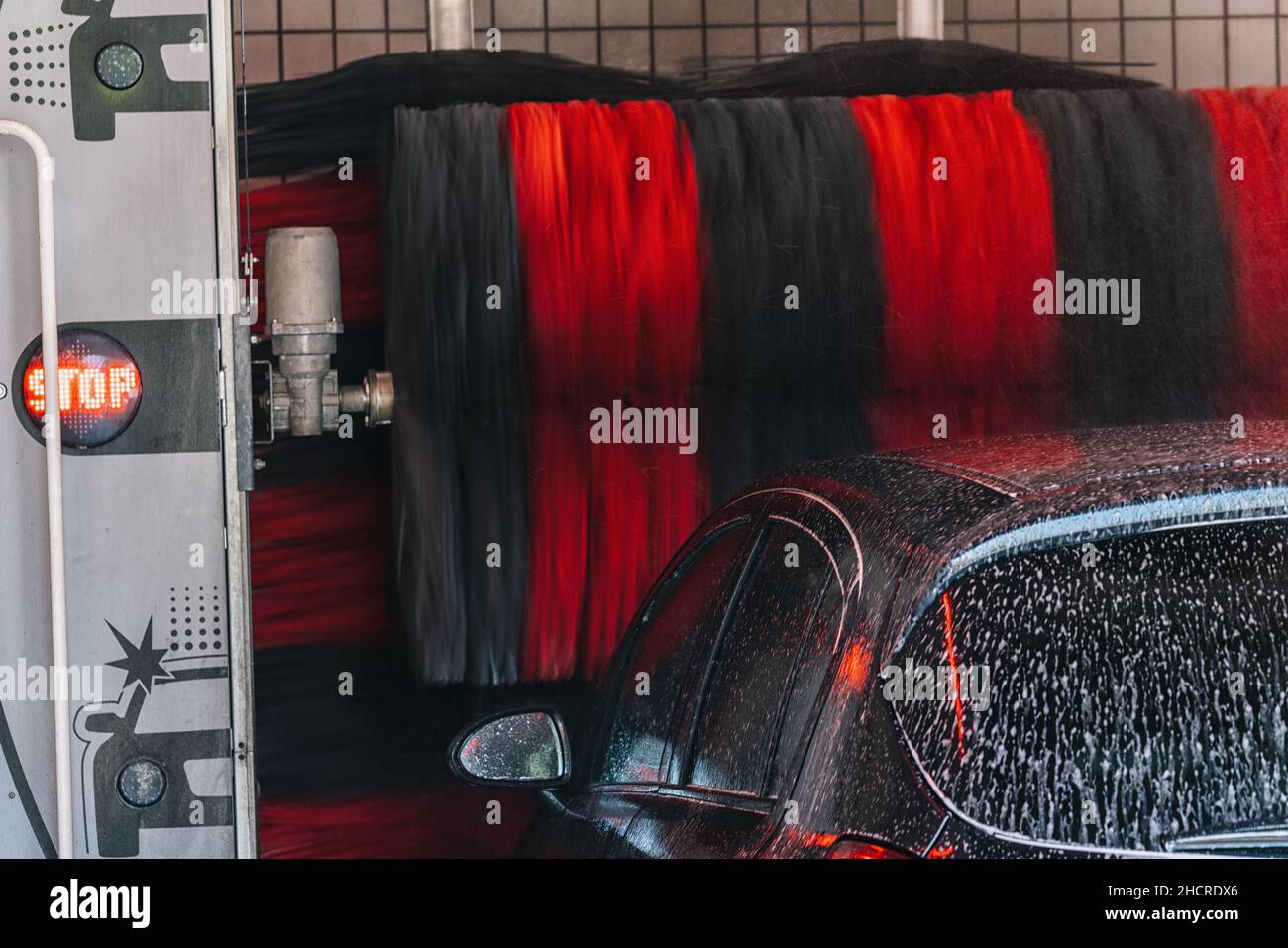car wash foam water, Automatic car wash brushes in action Stock Photo