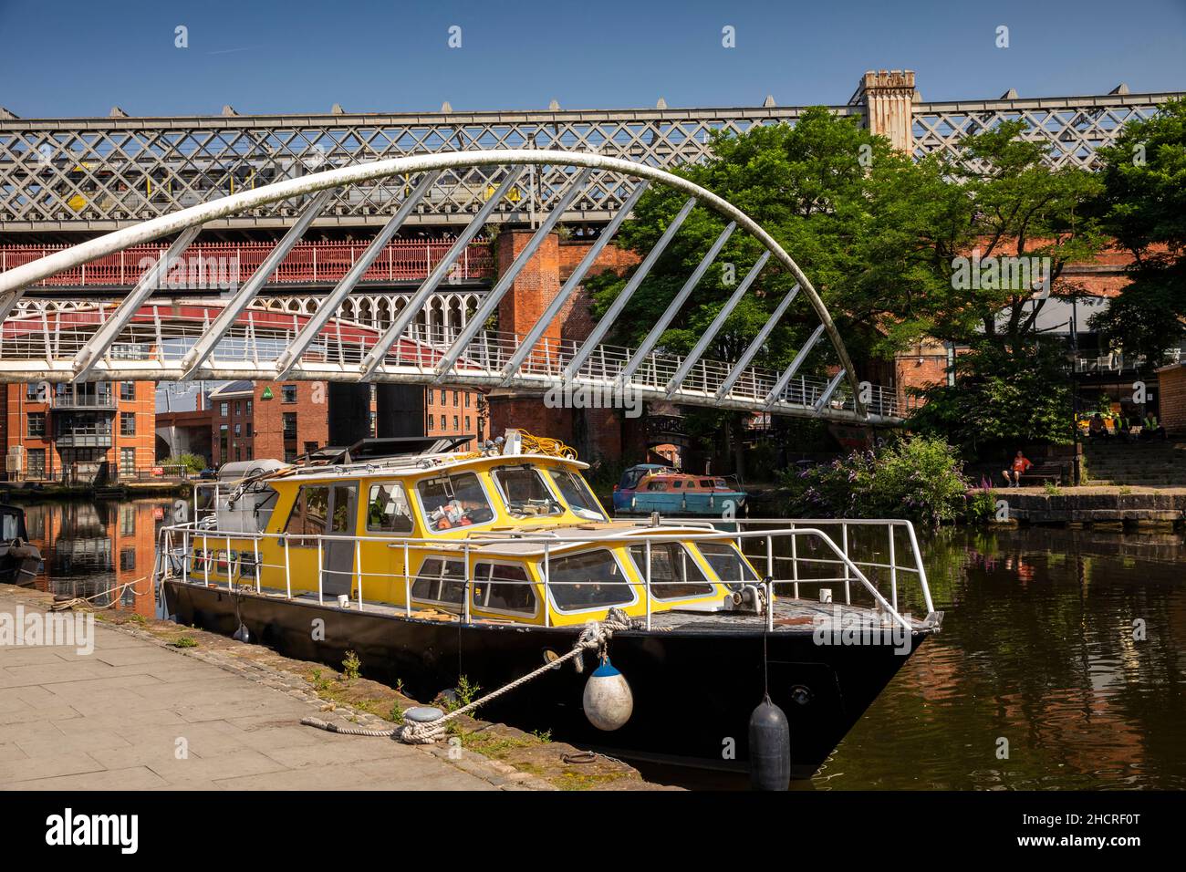 UK, England, Manchester, Castlefield, boat moored in Bridgewater Canal basin at Merchant’s Bridge Stock Photo