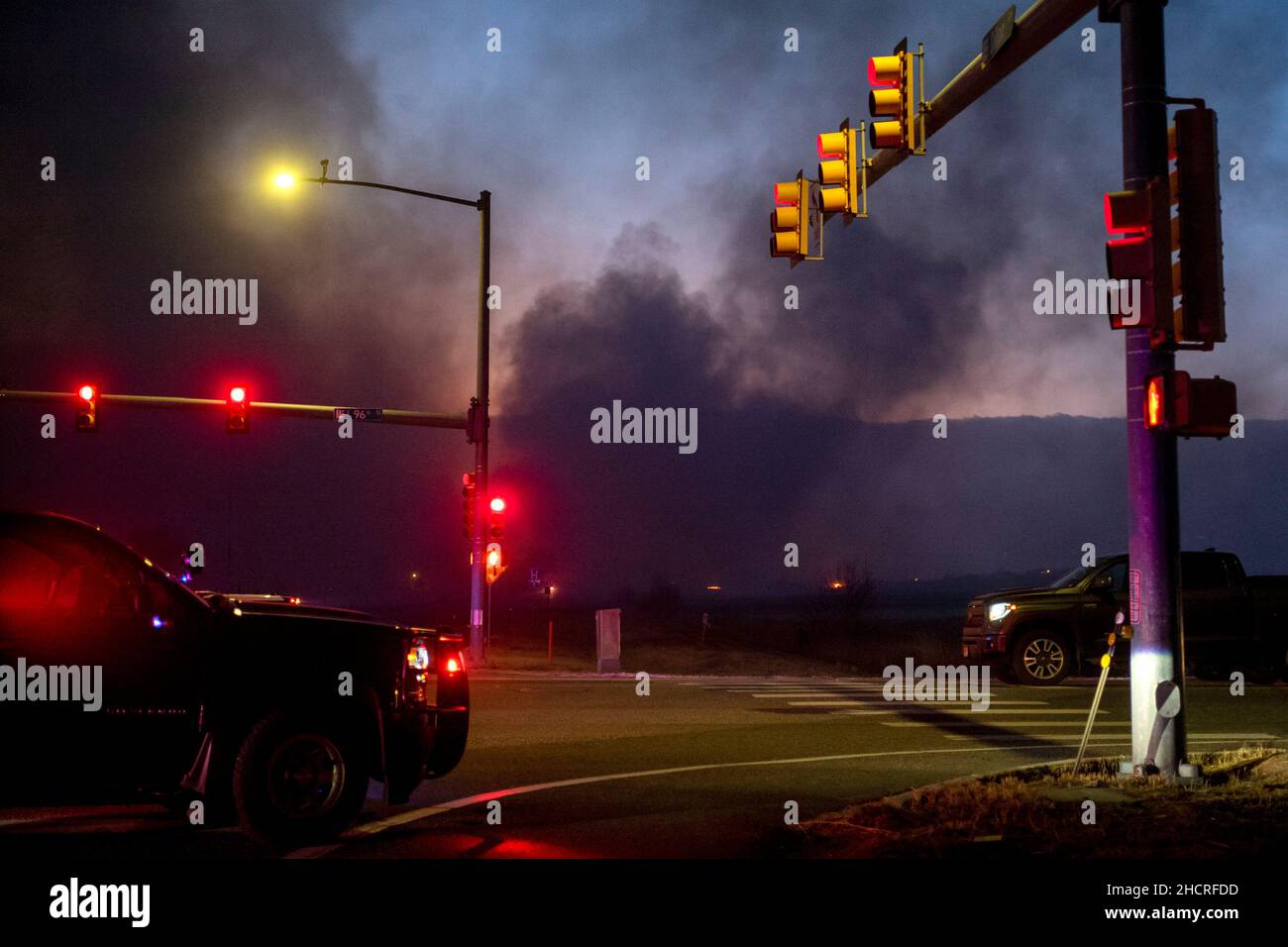 Boulder County, Colorado, USA. 30th Dec, 2021. Emergency personnel close down roads near 96th and Dillion Road after the Marshall fire spread rapidly through grasslands. The wind-driven fire moved east through Boulder County damaging and destroying homes as it burned 1,600 acres in Superior and Louisville, CO. (Credit Image: © Carl G Payne II/ZUMA Press Wire Service) Stock Photo