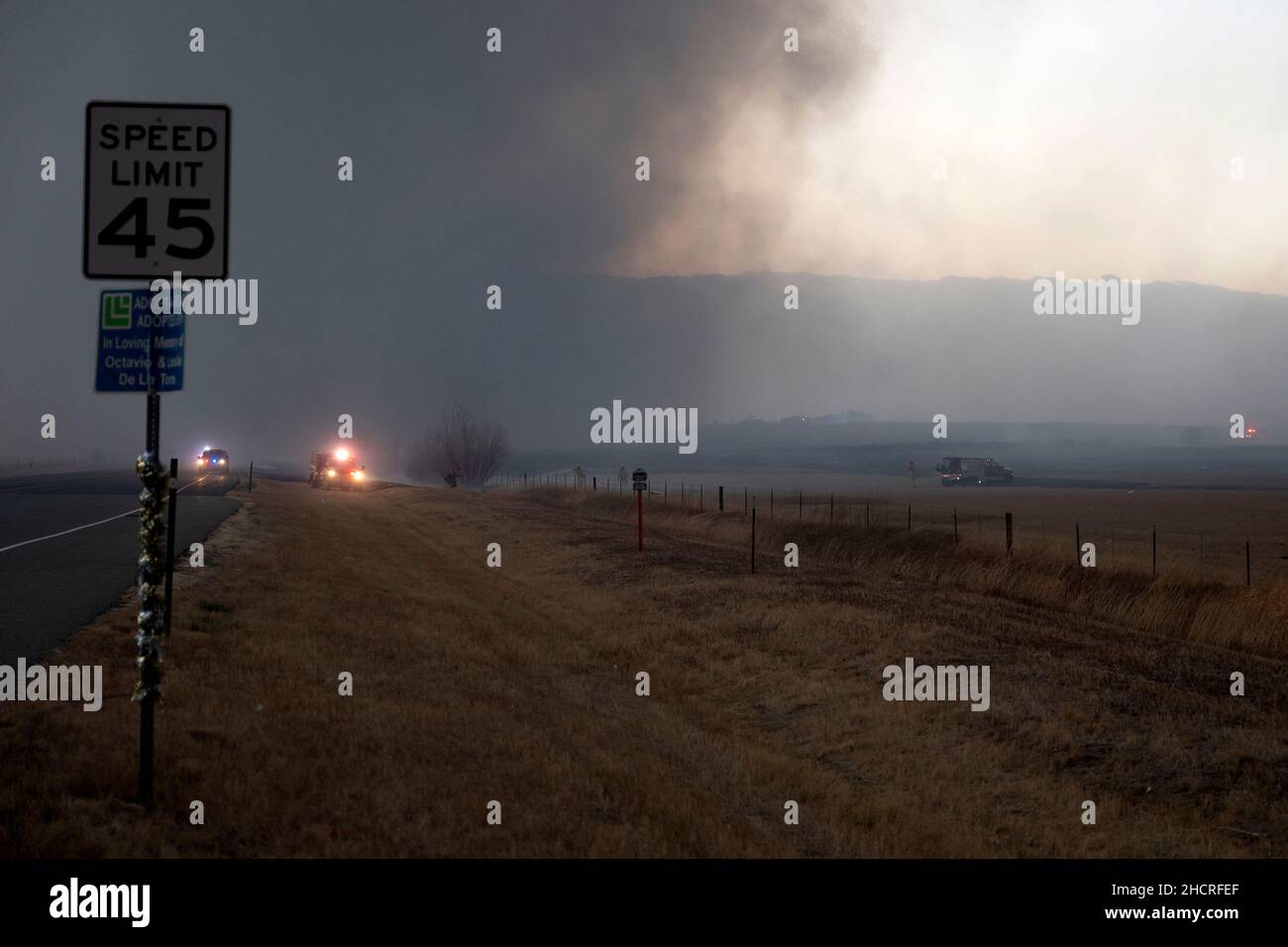 Boulder County, Colorado, USA. 30th Dec, 2021. Emergency personnel close down roads near 96th and Dillion Road after the Marshall fire spread rapidly through grasslands. The wind-driven fire moved east through Boulder County damaging and destroying homes as it burned 1,600 acres in Superior and Louisville, CO. (Credit Image: © Carl G Payne II/ZUMA Press Wire Service) Stock Photo