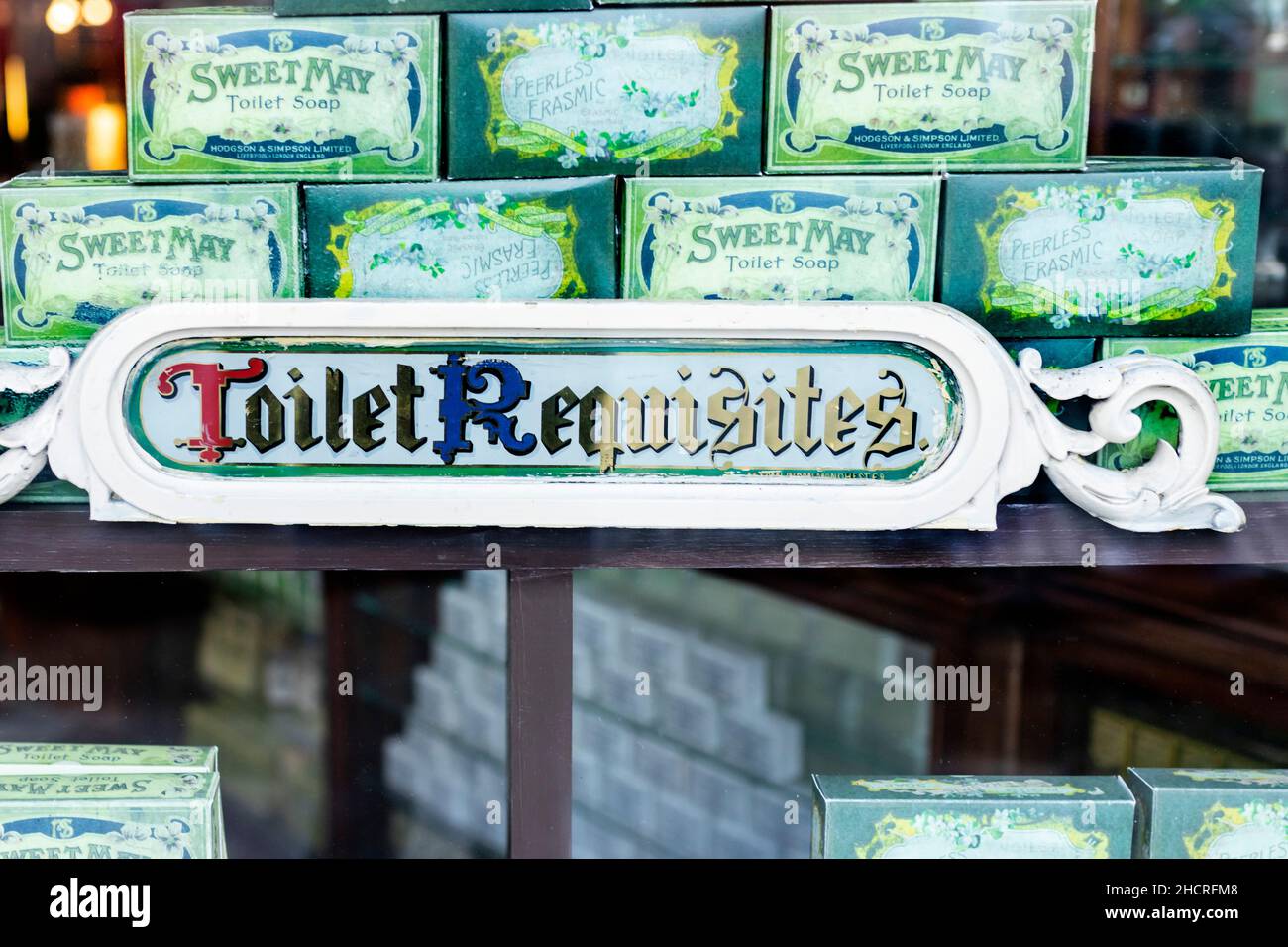sign for toilet requisites in shop window with vintage soaps at Beamish Village Stock Photo