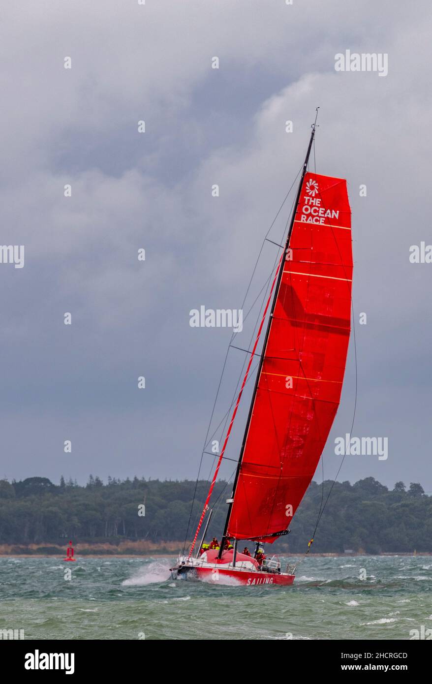 large racing yacht in the solent off of the isle of wight coast at the statrt of the fastnet yacht race at the end of annual cowes week yacht regatta Stock Photo