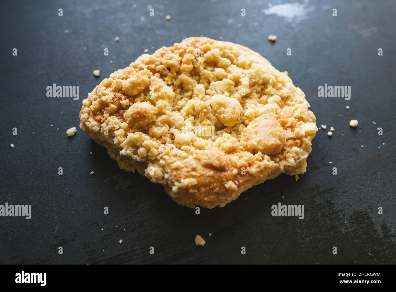 streusel bun or roll on old table Stock Photo