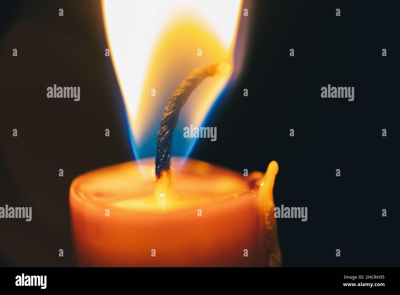 Candle flame close up on a black background Stock Photo
