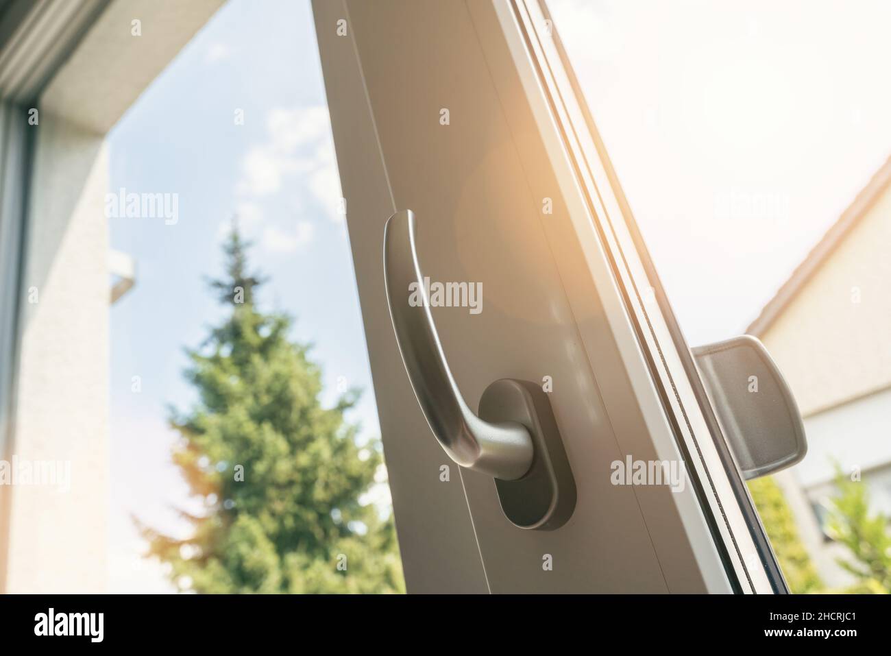 opened white plastic pvc window with sunlight Stock Photo Alamy