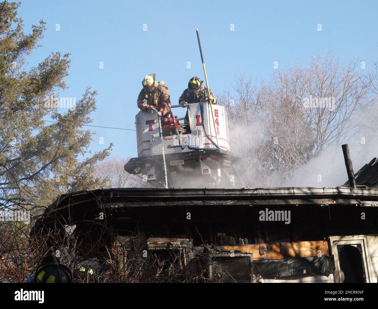 Firefighters in Aerial bucket Stock Photo