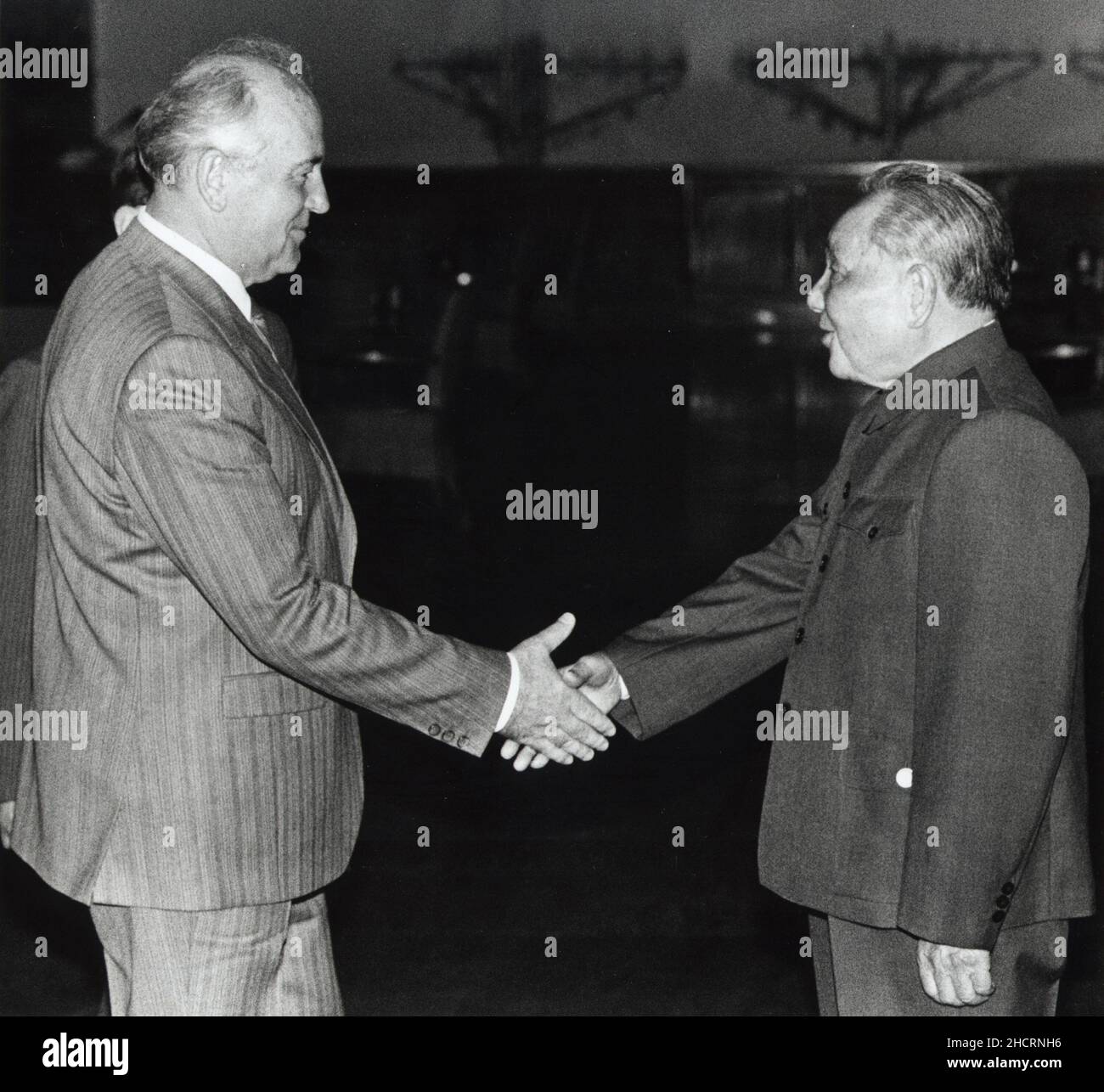 Former Chinese leader Deng Xiaoping greets former leader of the Soviet Union Mikhail Gorbachev in the Great Hall of the People in May 1989. Their meeting is considered the end of the 'Sino-Soviet split.' Stock Photo