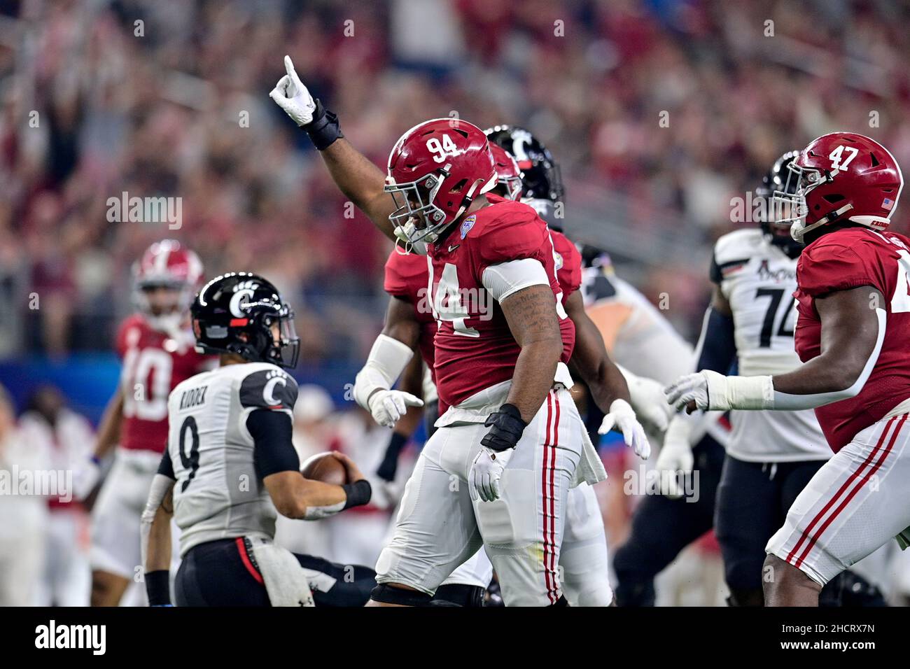 Cincinnati Bearcats quarterback Desmond Ridder (9) is sacked by Alabama