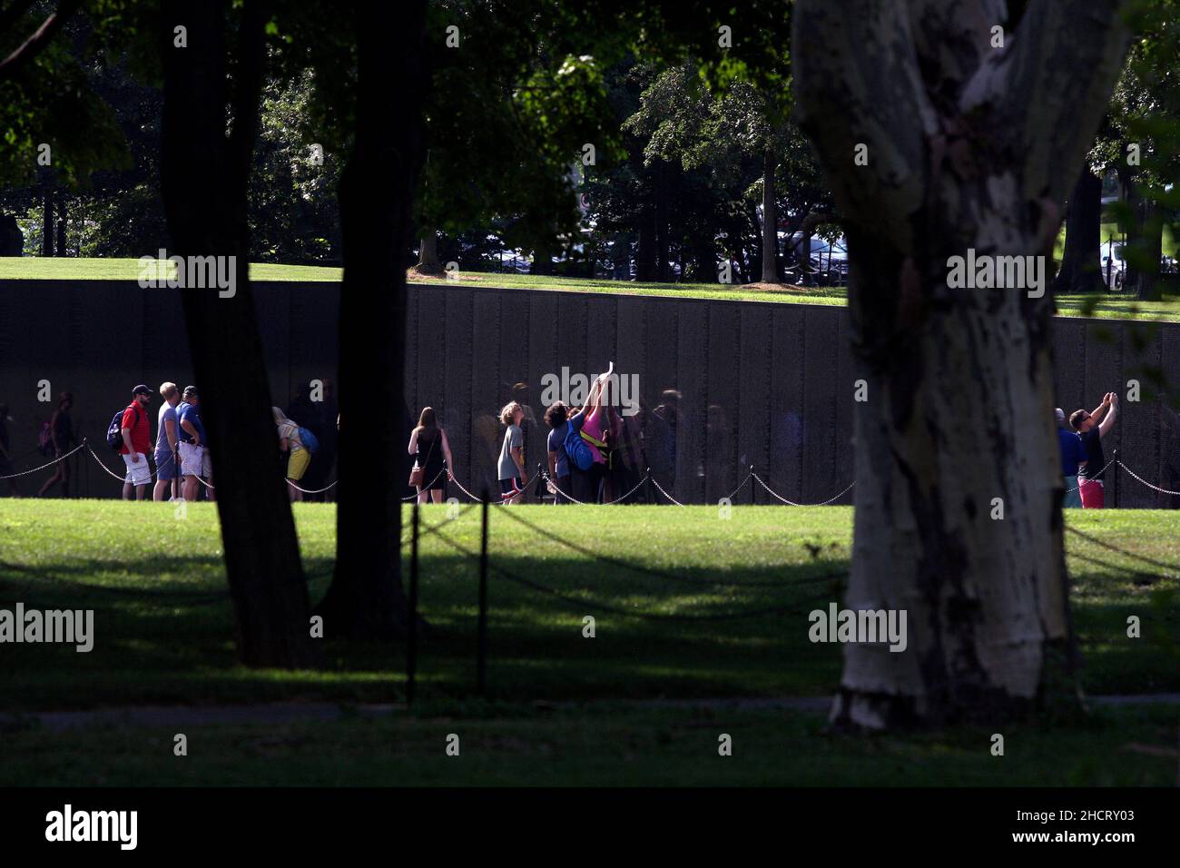 Visitors to the Vietnam Veterans Memorial in Washington, D.C. The memorial was designed by Maya Lin. Stock Photo