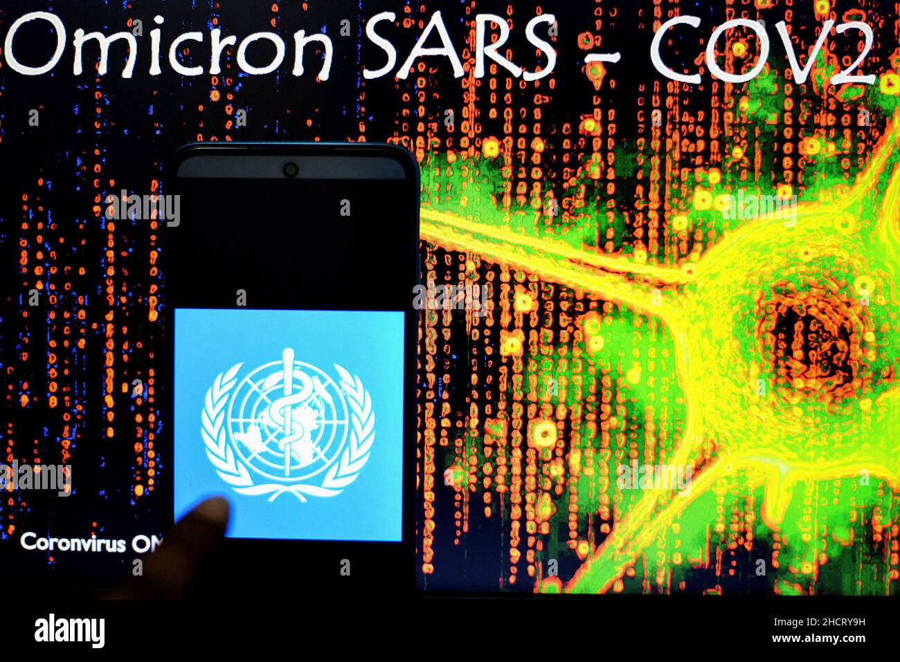 India. 31st Dec, 2021. In this photo illustration a WHO(World Health organization) logo seen on a smartphone with an Omicron SARS Cov2 illustration in the background. Credit: SOPA Images Limited/Alamy Live News Stock Photo