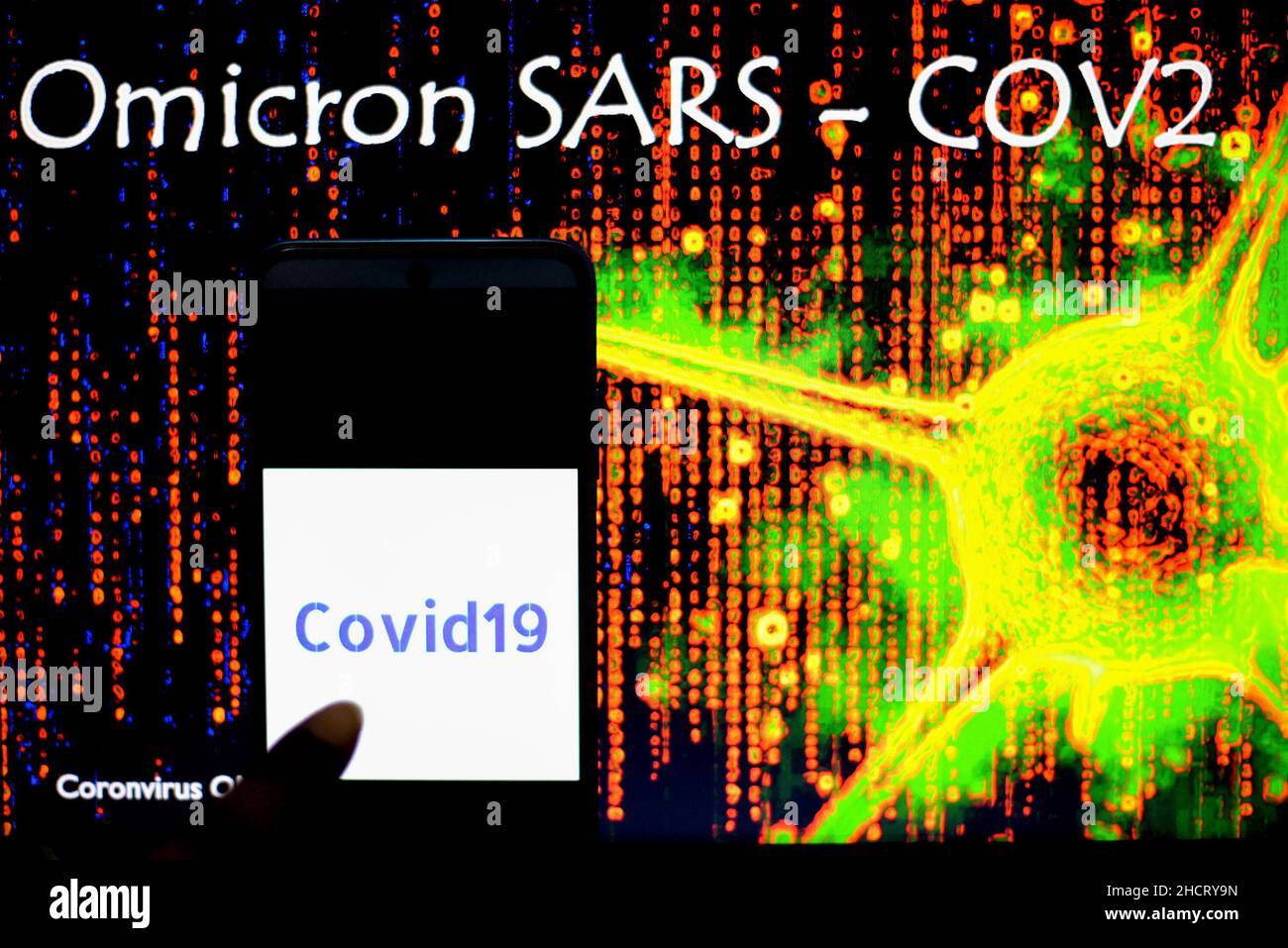 India. 31st Dec, 2021. In this photo illustration a Covid19 logo seen on a smartphone with an Omicron SARS Cov2 illustration in the background. Credit: SOPA Images Limited/Alamy Live News Stock Photo
