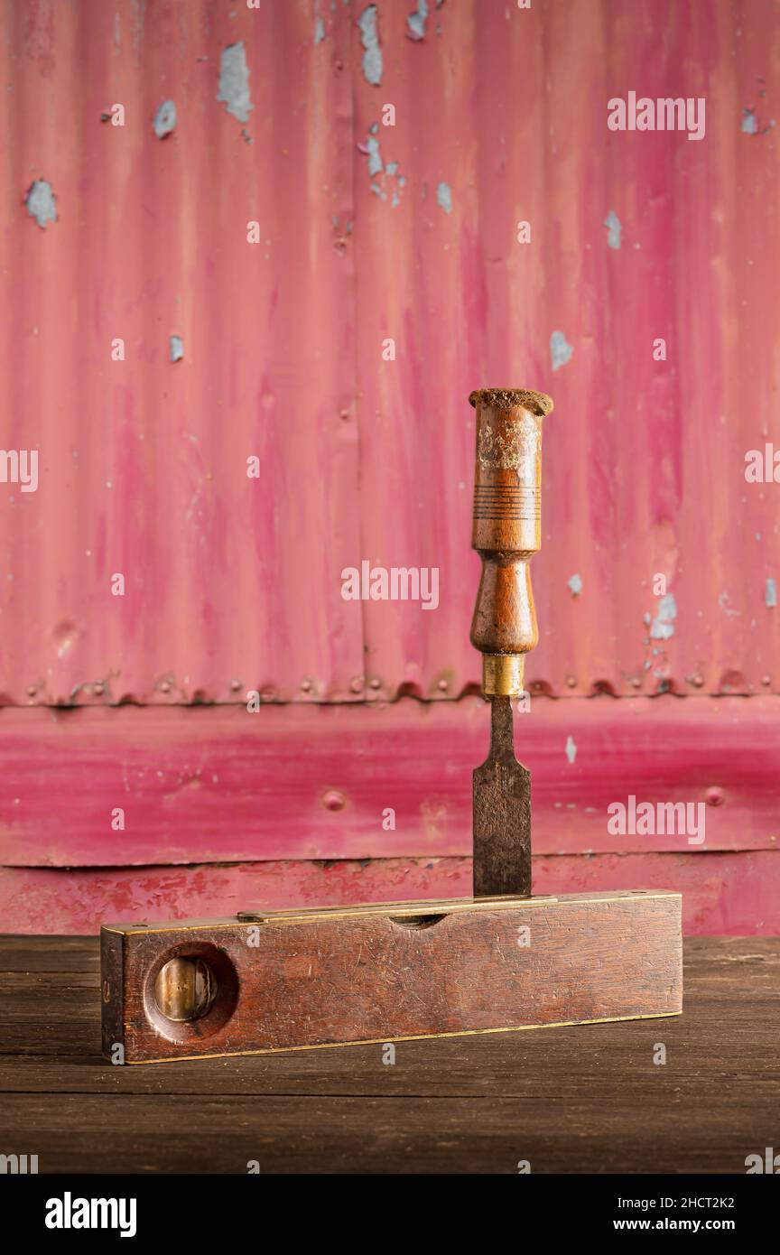 Spirit level and chisel Stock Photo