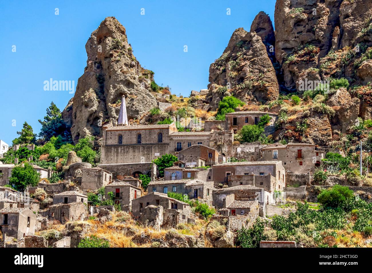 Small village of Pentedattilo, church and ruins of the abandoned village, Greek colony on Mount Calvario, whose form recalls the five fingers. Calabri Stock Photo