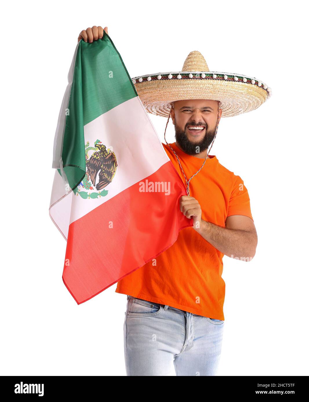 Emotional man in sombrero and with flag of Mexico on white background Stock Photo