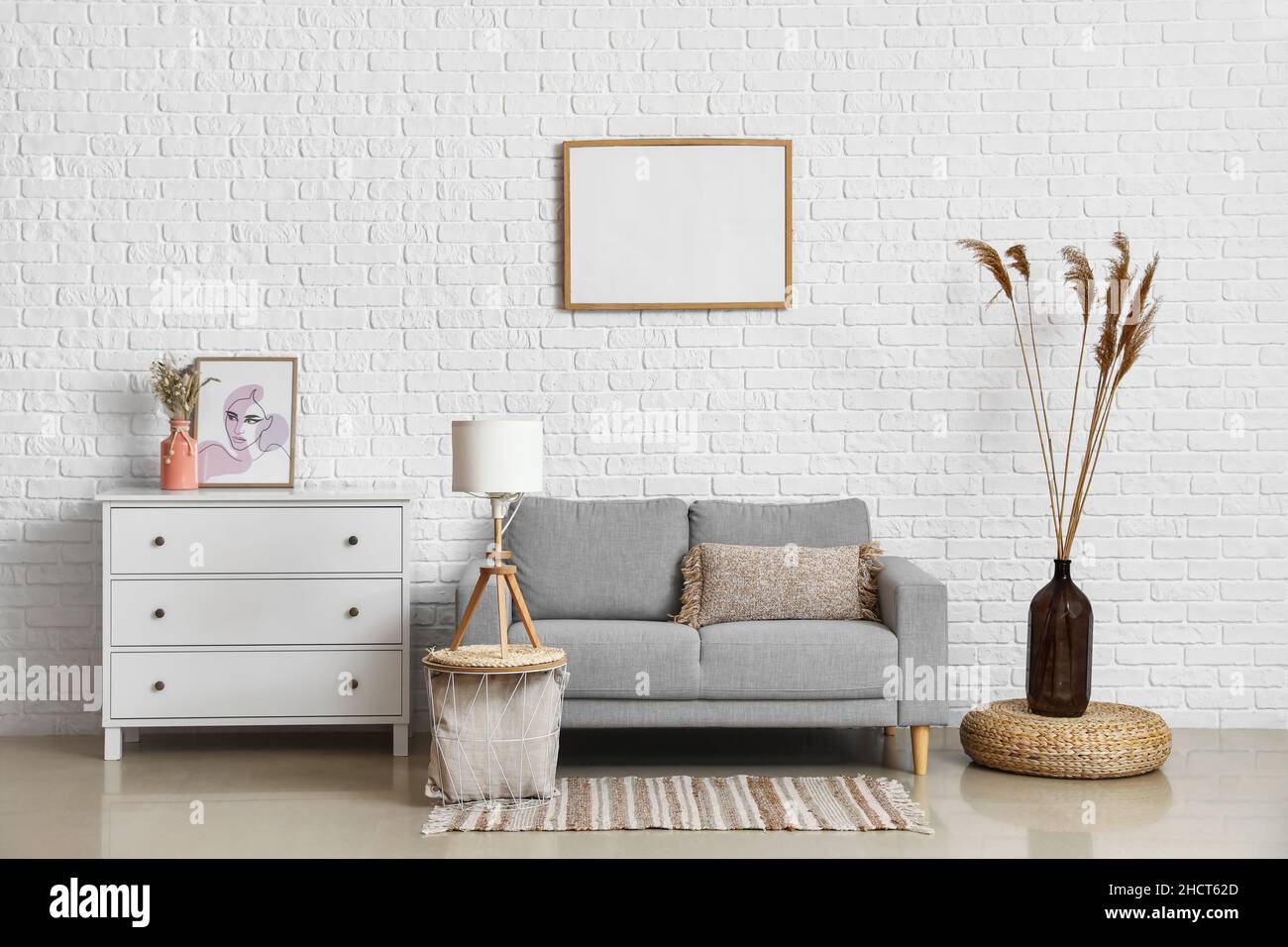 Interior of light living room with sofa, commode and coffee table Stock ...