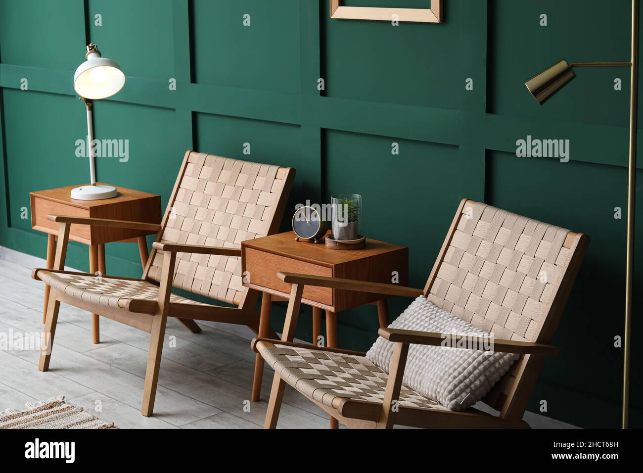 Interior of modern living room with chairs, wooden tables and lamp