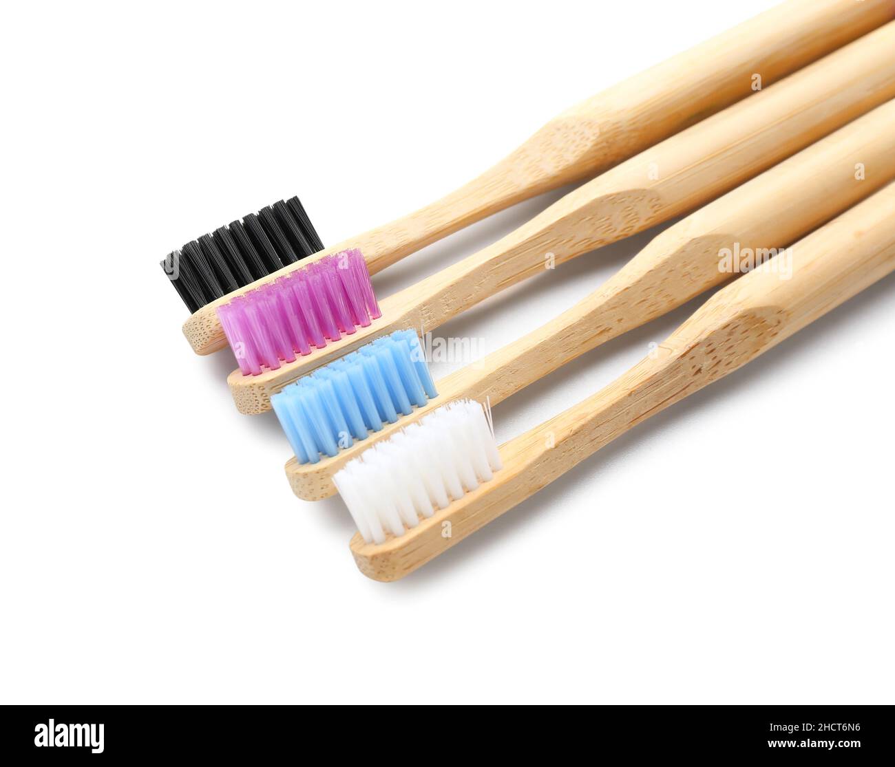 Bamboo toothbrushes on white background Stock Photo - Alamy
