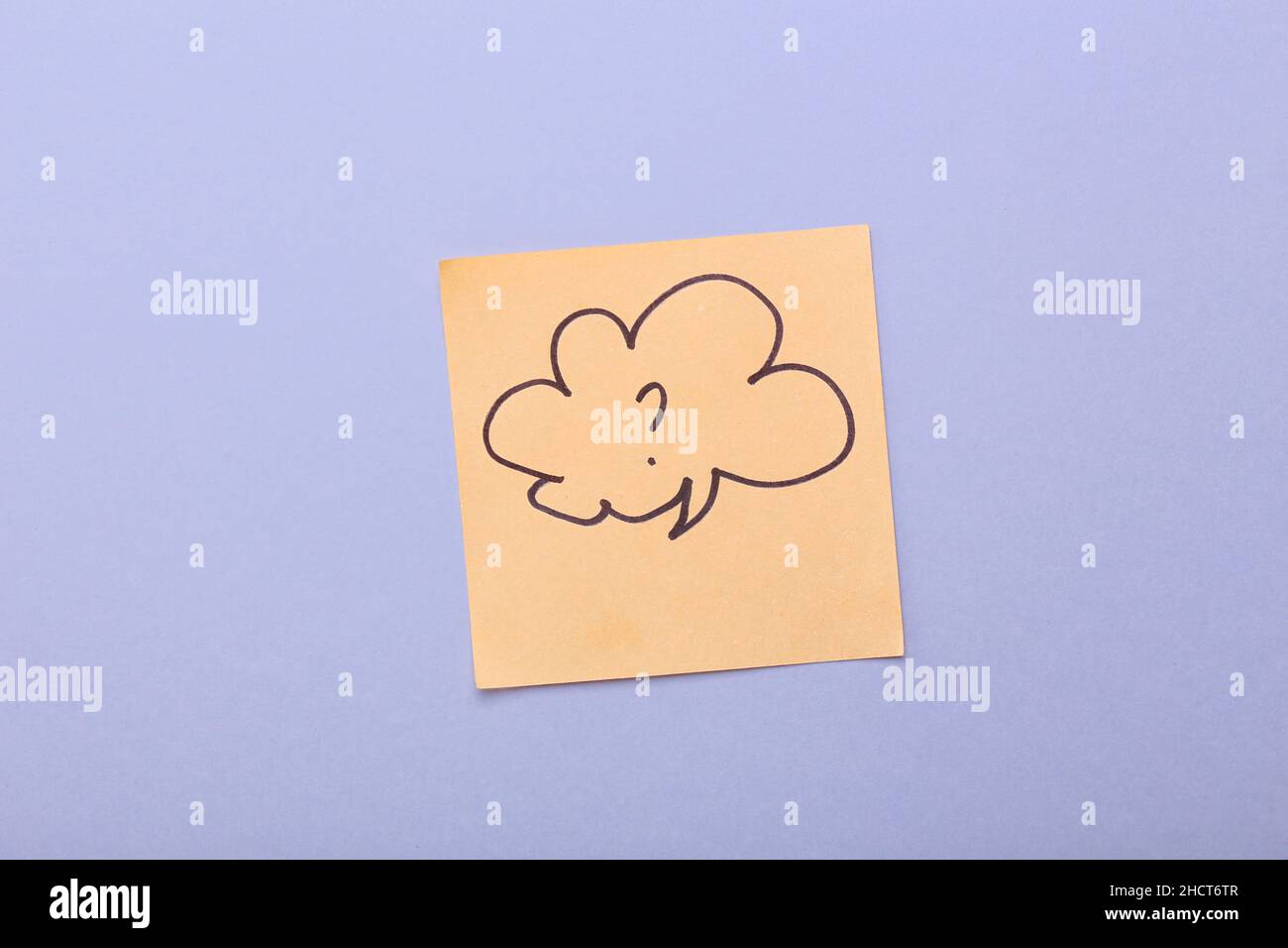 Sticky note with drawn speech bubble and question mark on grey background Stock Photo