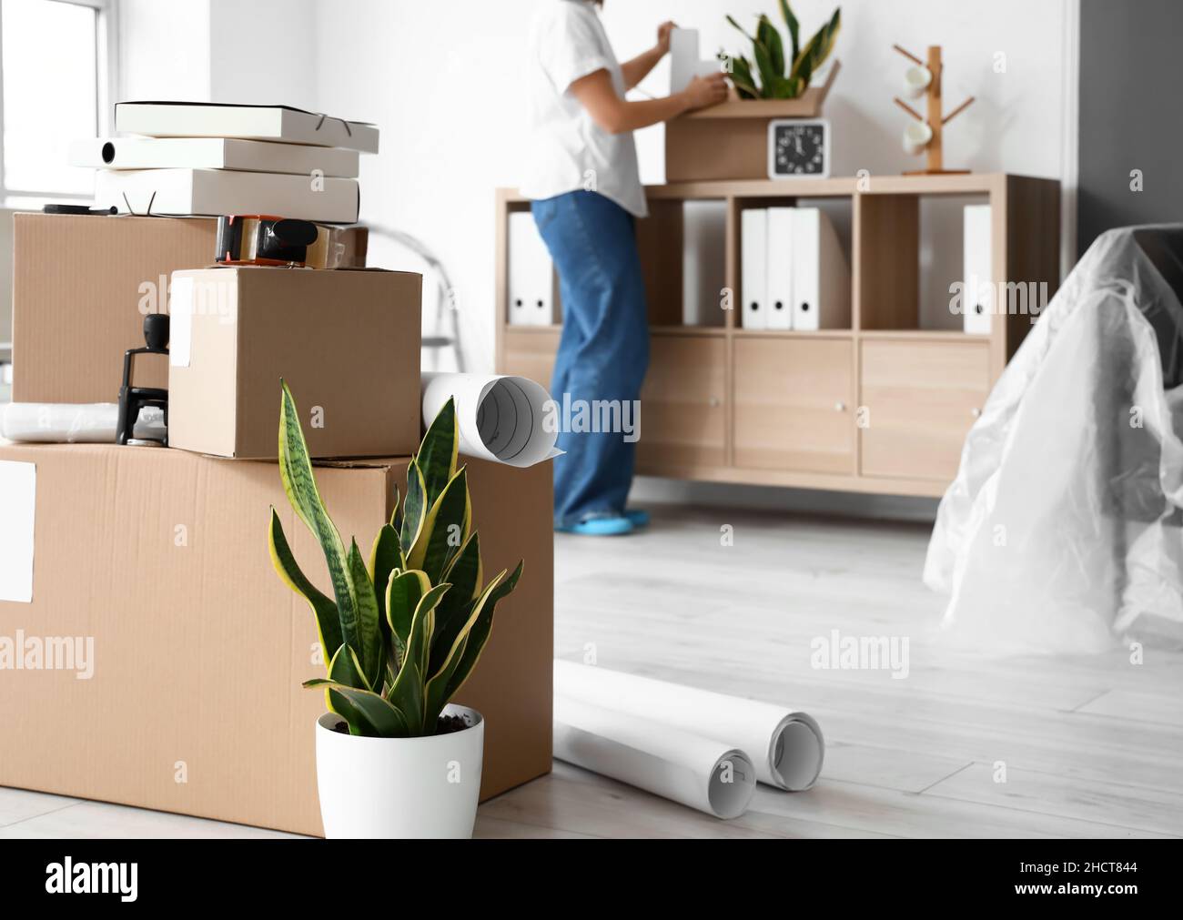 Cardboard boxes with belongings in office on moving day Stock Photo Alamy