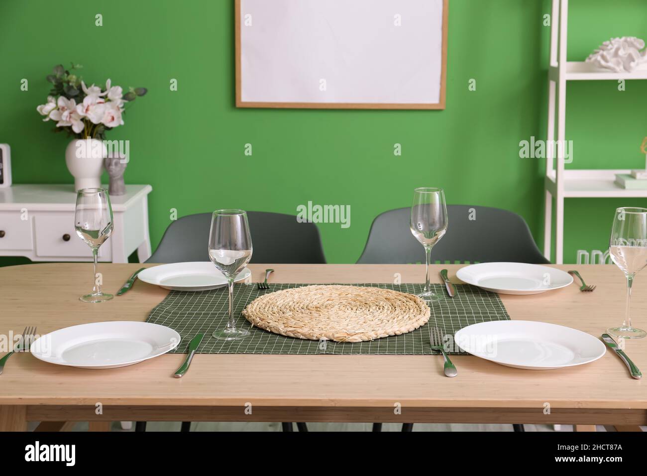 Beautiful dining table with setting in room Stock Photo - Alamy