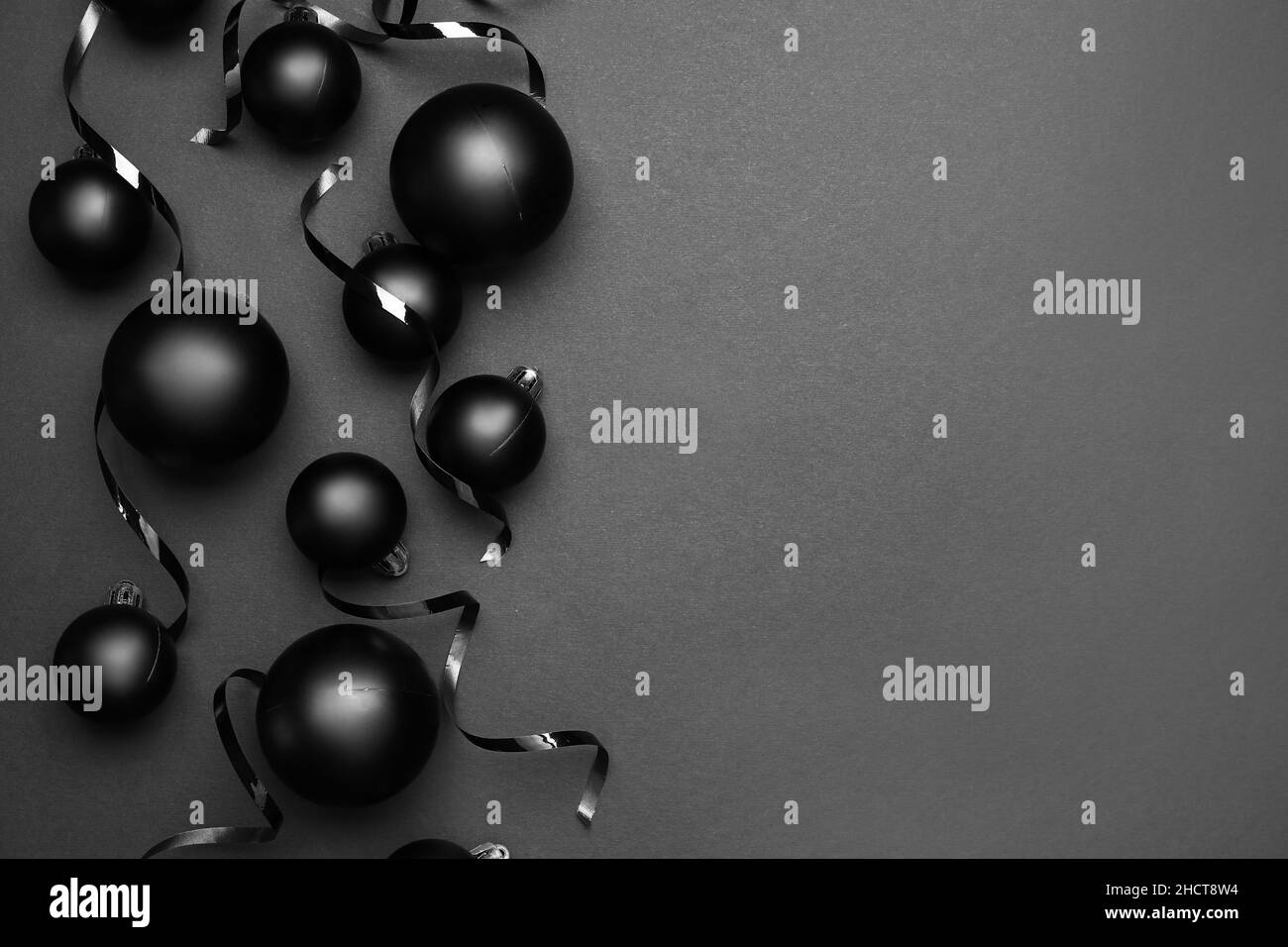 Beautiful Christmas balls and ribbons on dark background Stock Photo