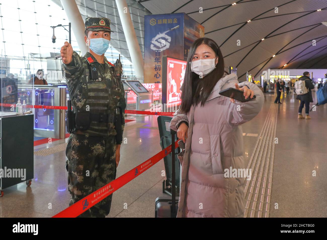 NANNING, CHINA - JANUARY 1, 2022 - Officers and soldiers help ...