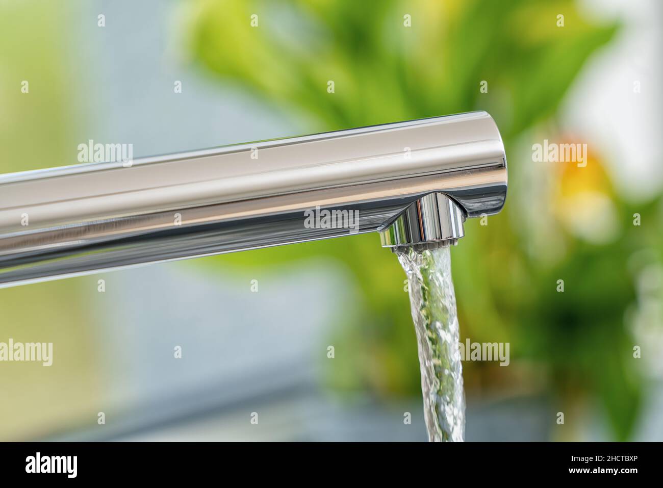 faucet and water flow Stock Photo