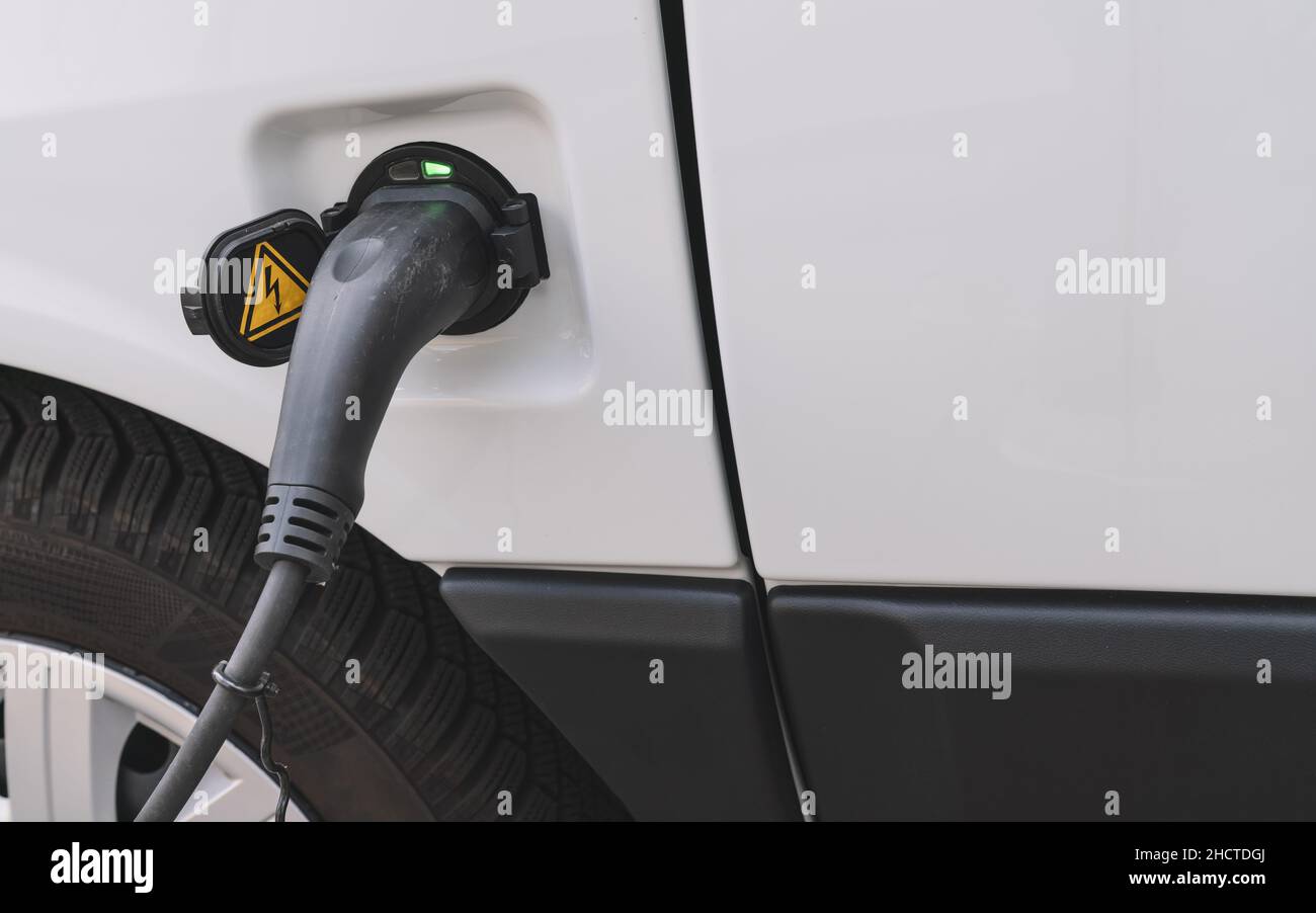 Power supply for electric car is full loaded. Electric car charging