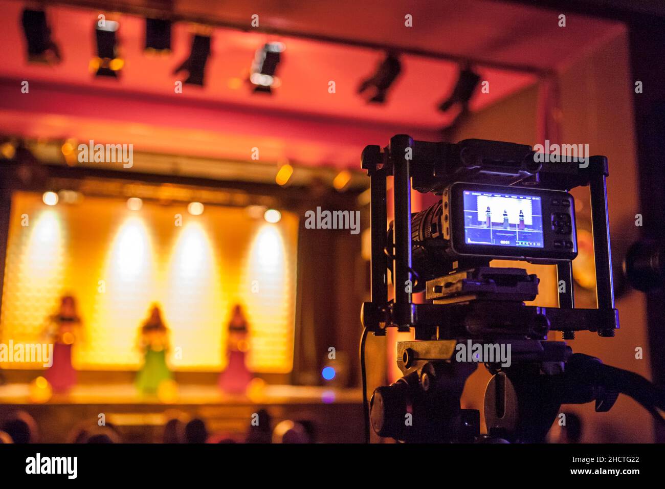 Digital video camera recording dance show. Warm ambience Stock Photo Alamy