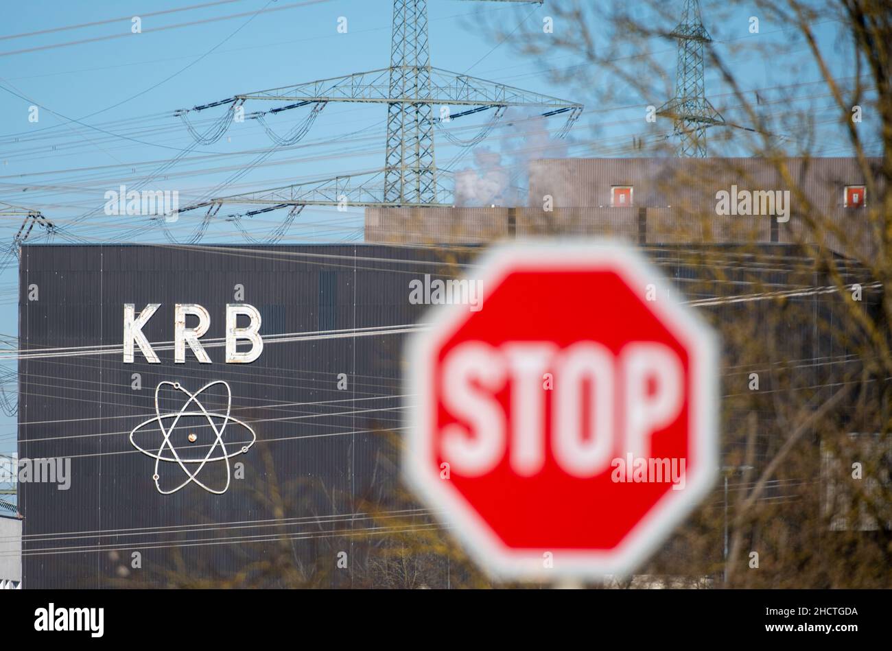 Gundremmingen, Germany. 01st Jan, 2022. A stop sign stands in front of a  nuclear logo. The nuclear power plant in Gundremmingen, Swabia, stopped  operating on New Year's Eve (31 December 2021) as