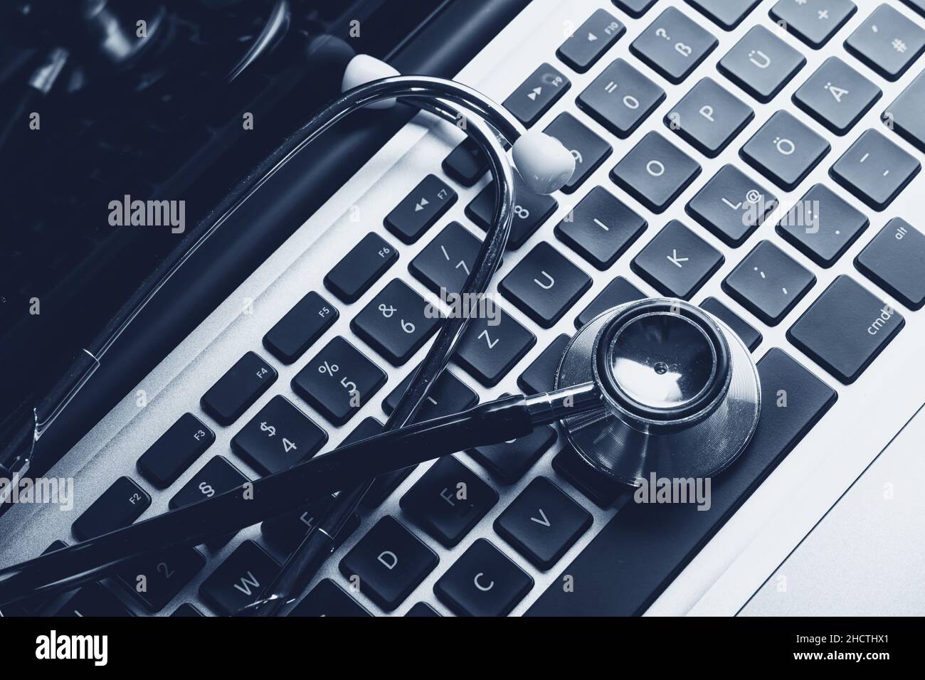 Stethoscope on laptop keyboard Stock Photo - Alamy