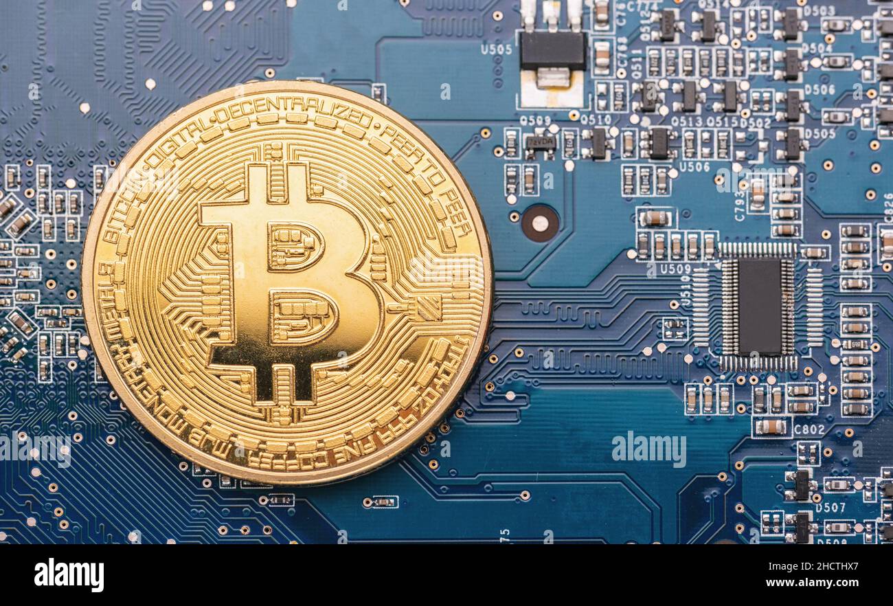 cryptocurrency Bitcoin on a Mother board Stock Photo