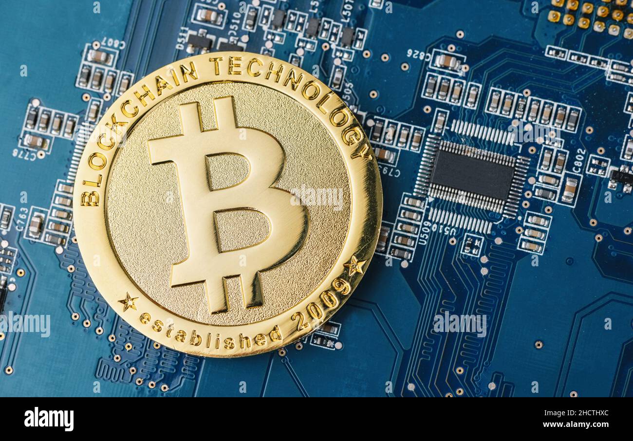cryptocurrency Bitcoin on a Mother board Stock Photo