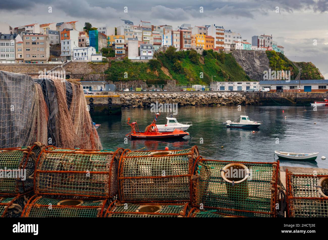 Malpica, A Coruna Province, Galicia, Spain.  View over fishing harbour to town. Stock Photo