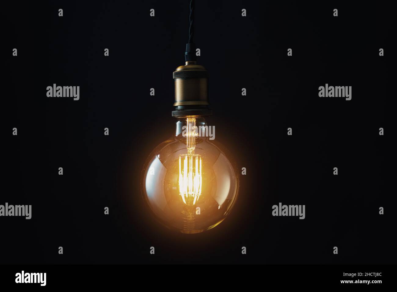 Edison Lightbulb on black background Stock Photo