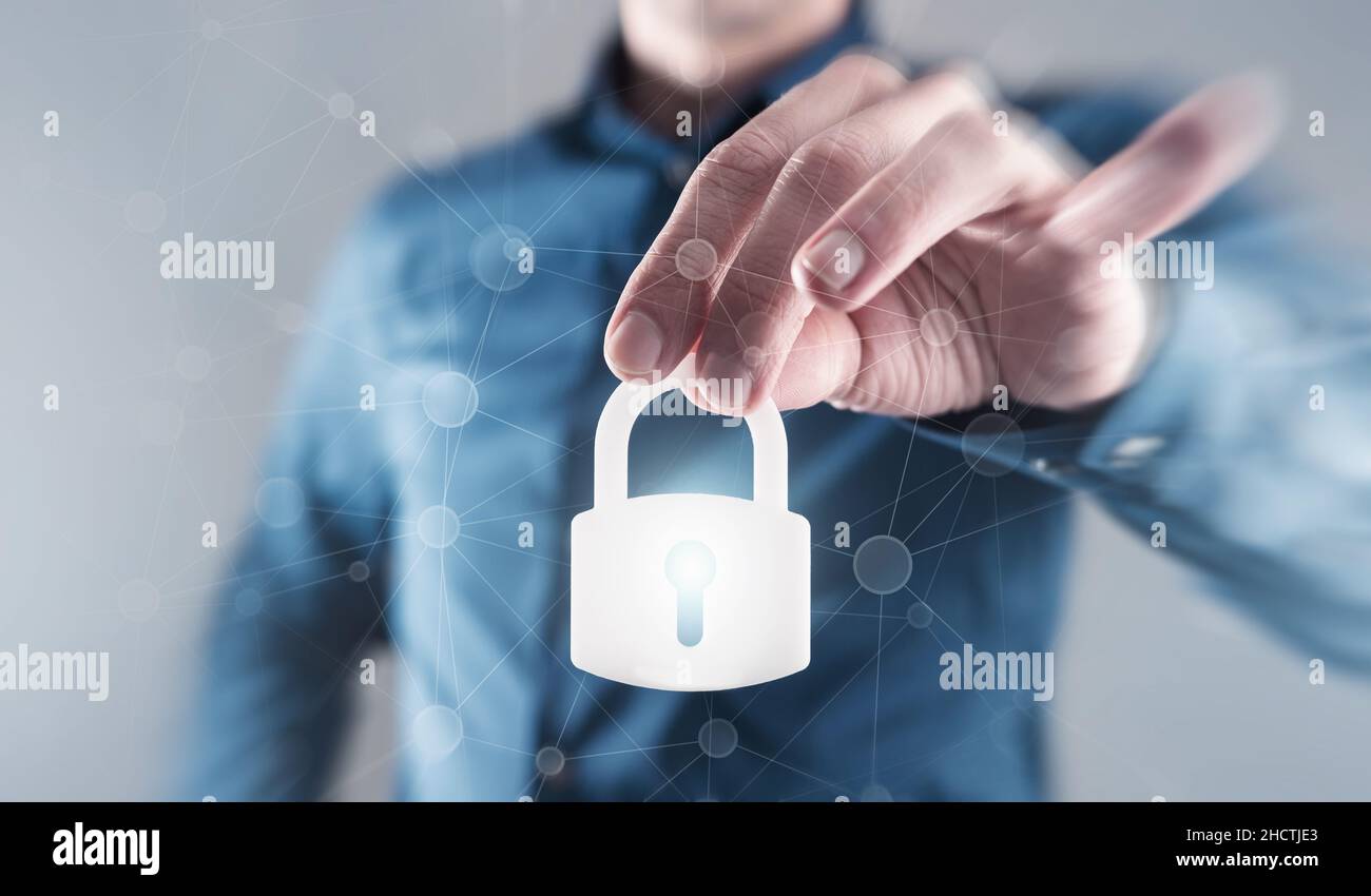 Businessman holding digital padlock to the secure Stock Photo